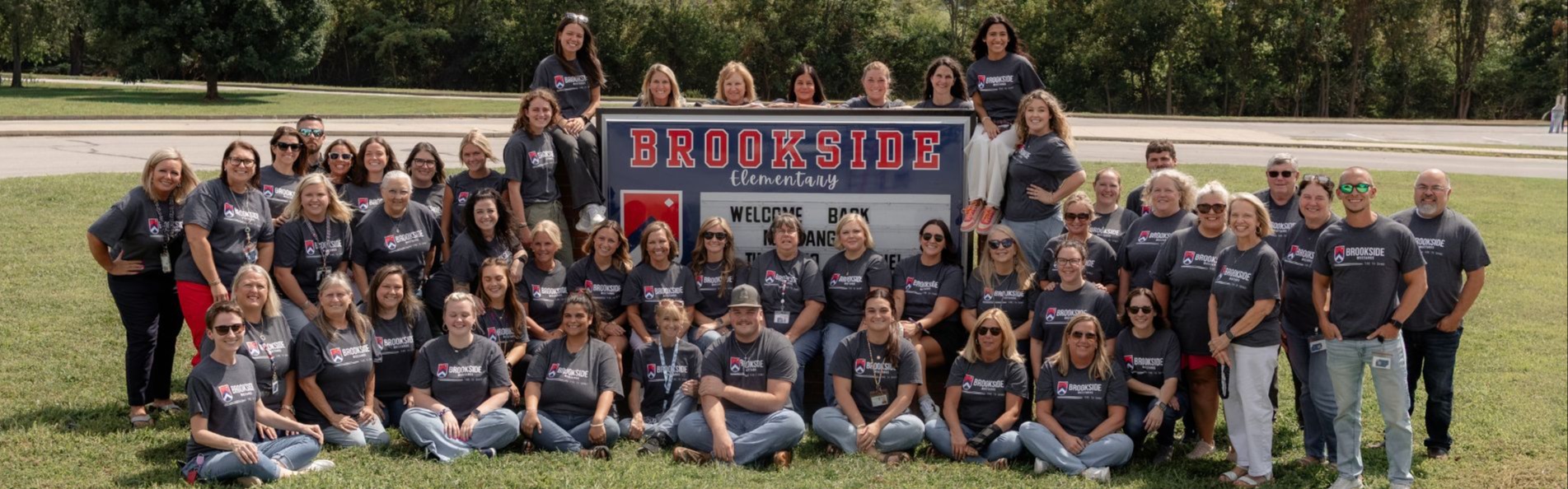 Staff Picture with school sign