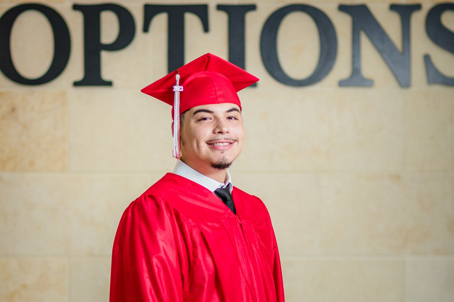 Options student in cap and gown