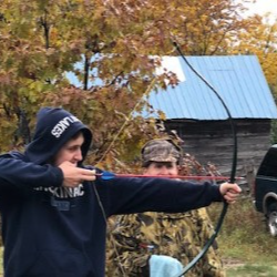 man shooting bow