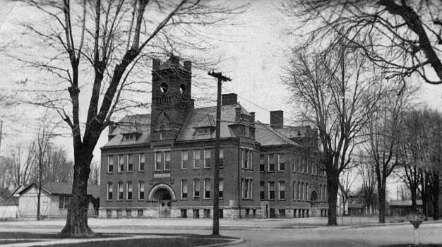 A black and white photo of a bigger school, constructed around 1896.