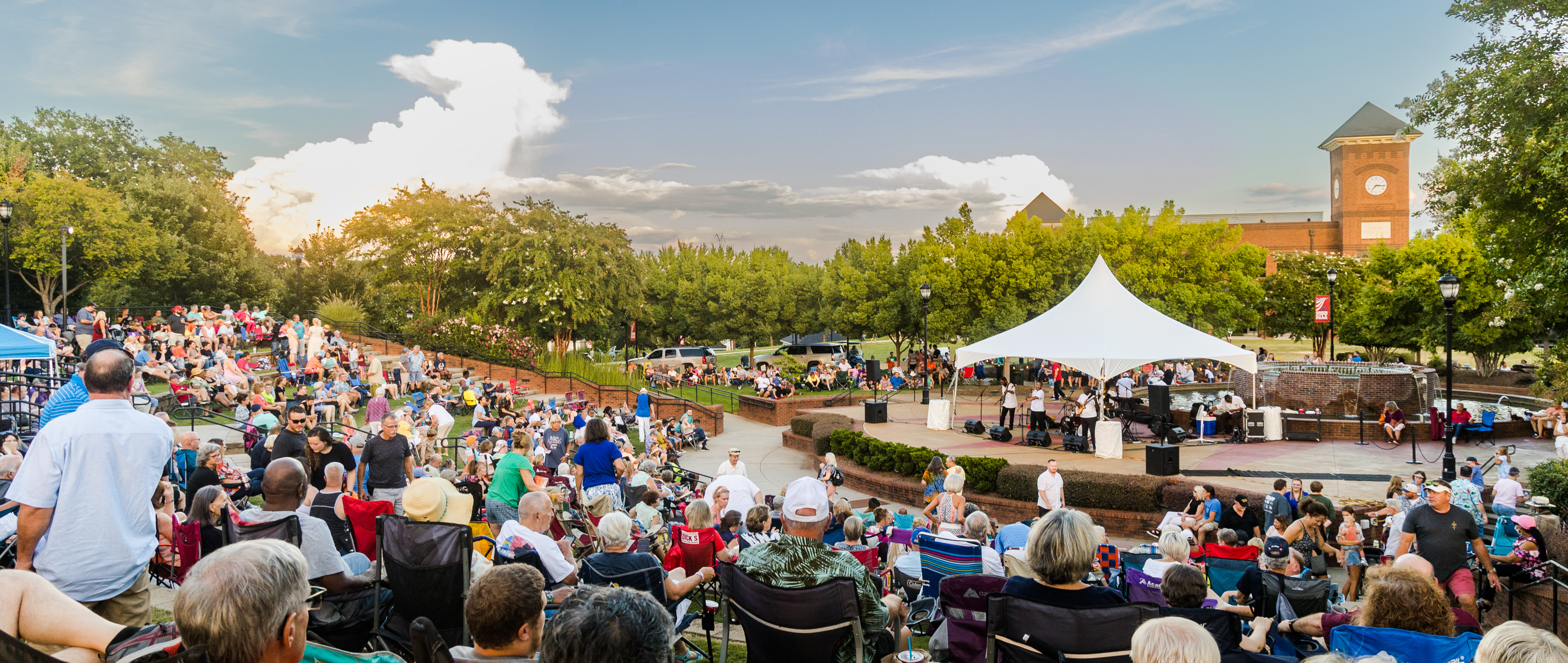 A photograph of a summer concert series in the park