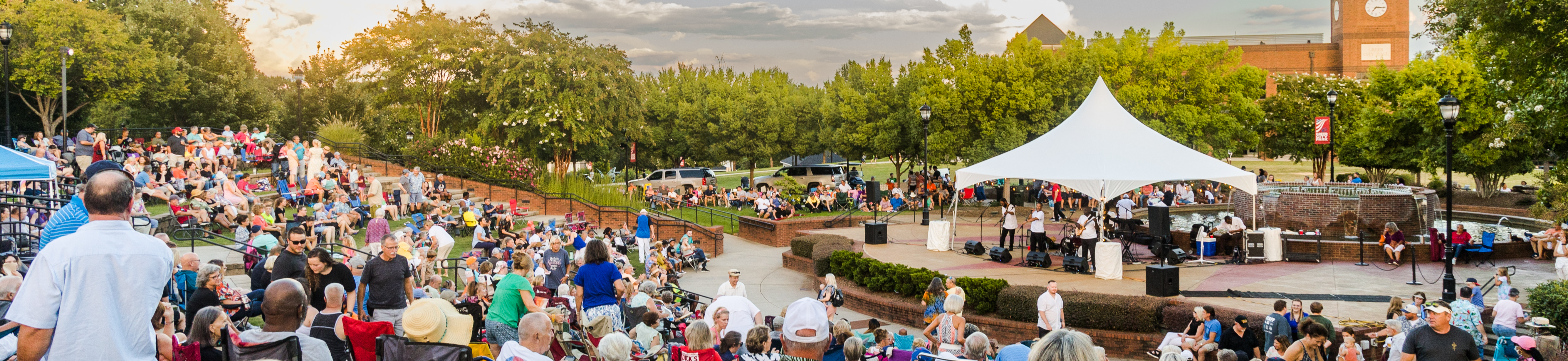 A photograph of a summer concert series in the park