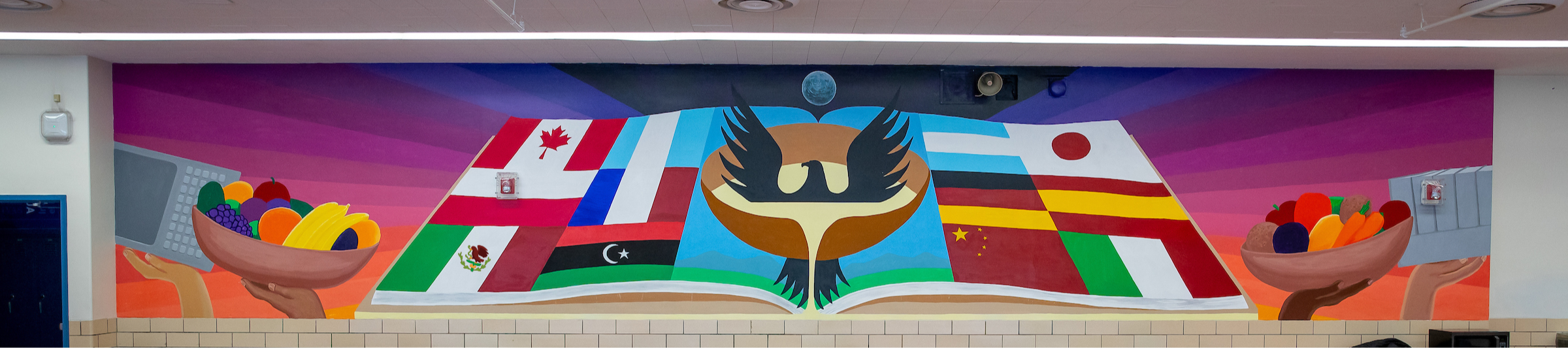 Mural of flags in school cafeteria