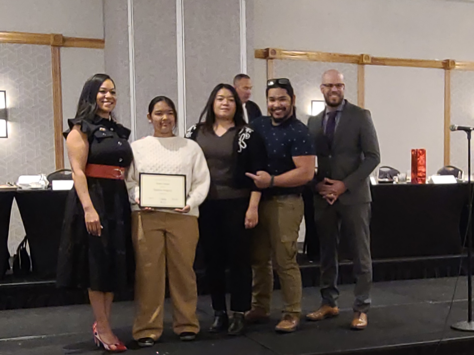 Group of people accepting award