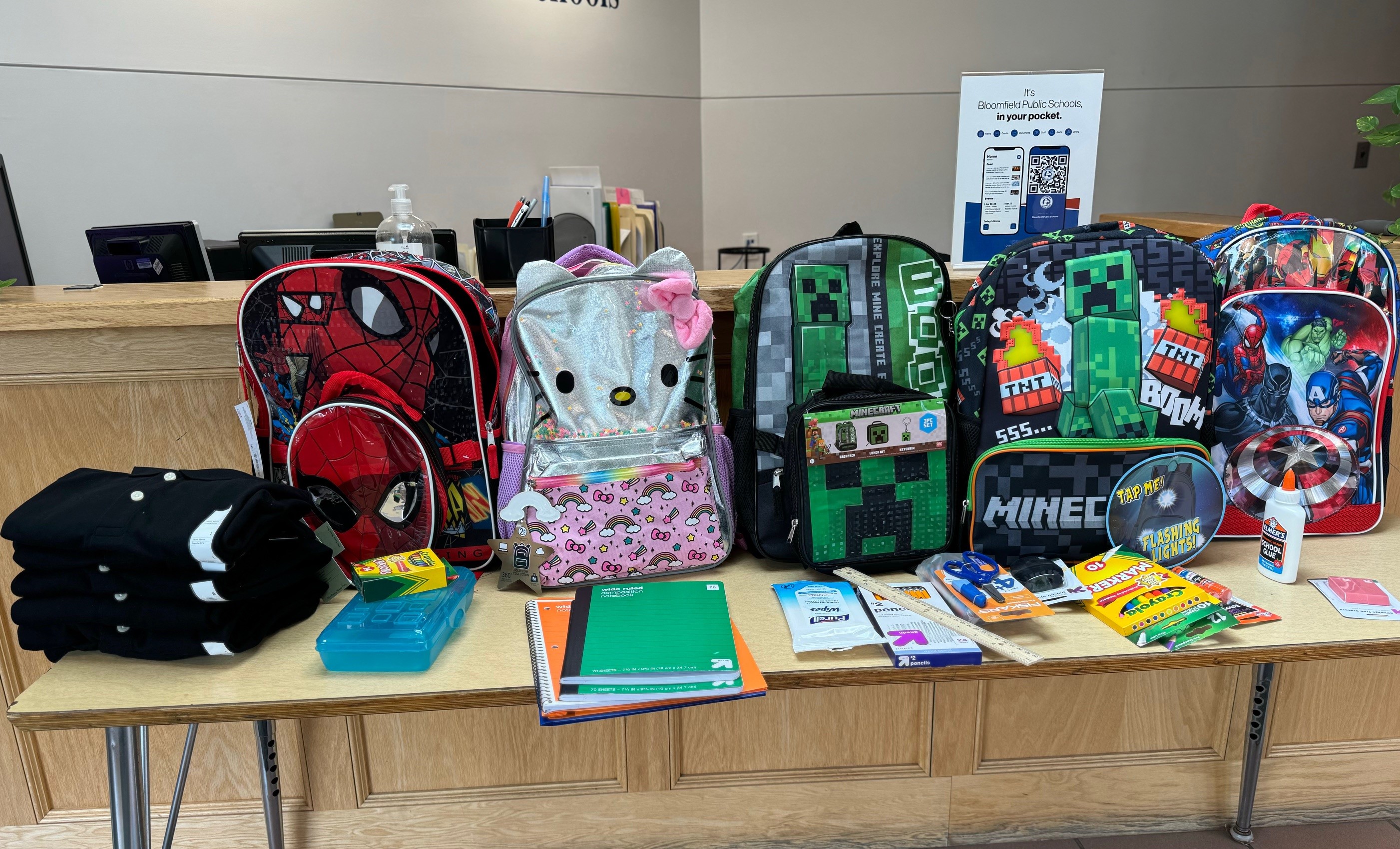 backpacks and school supplies on table