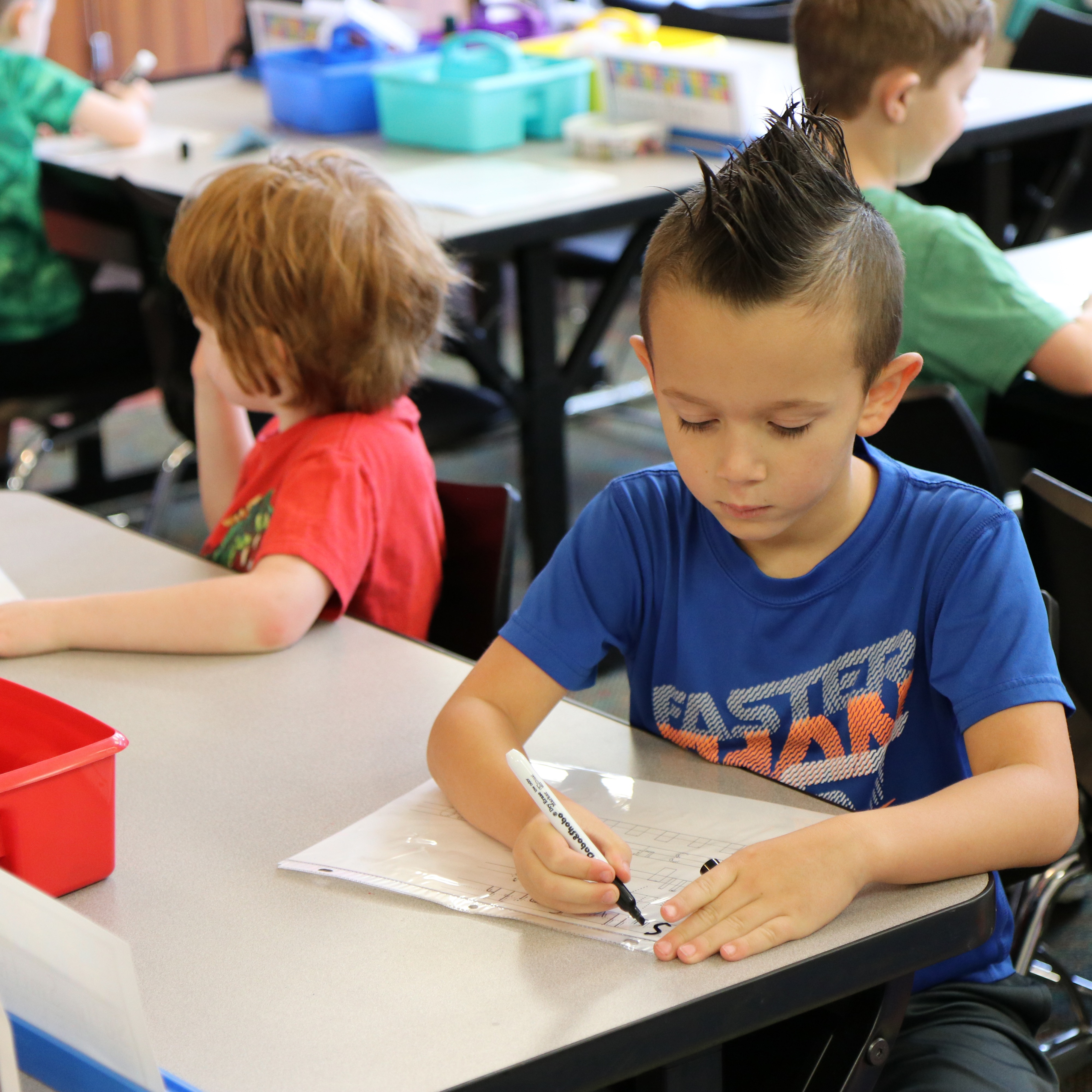 student at his desk