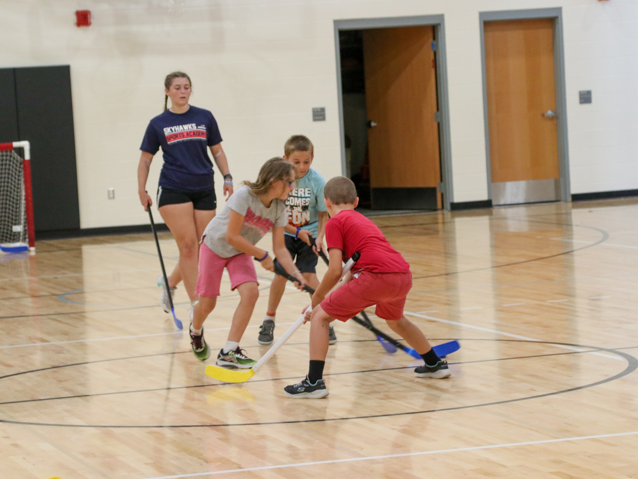 kids playing floor hockey