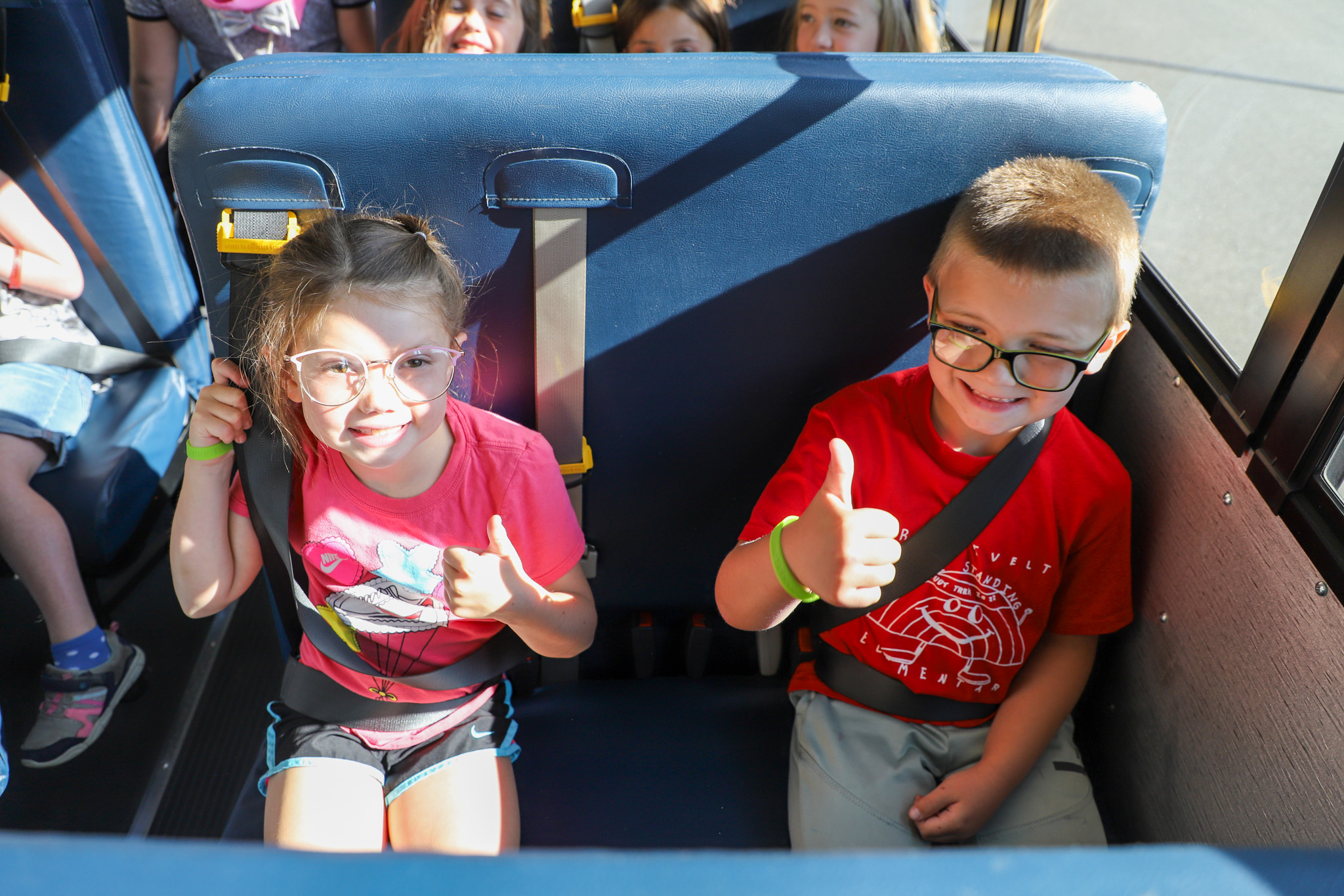 kids sitting on a bus