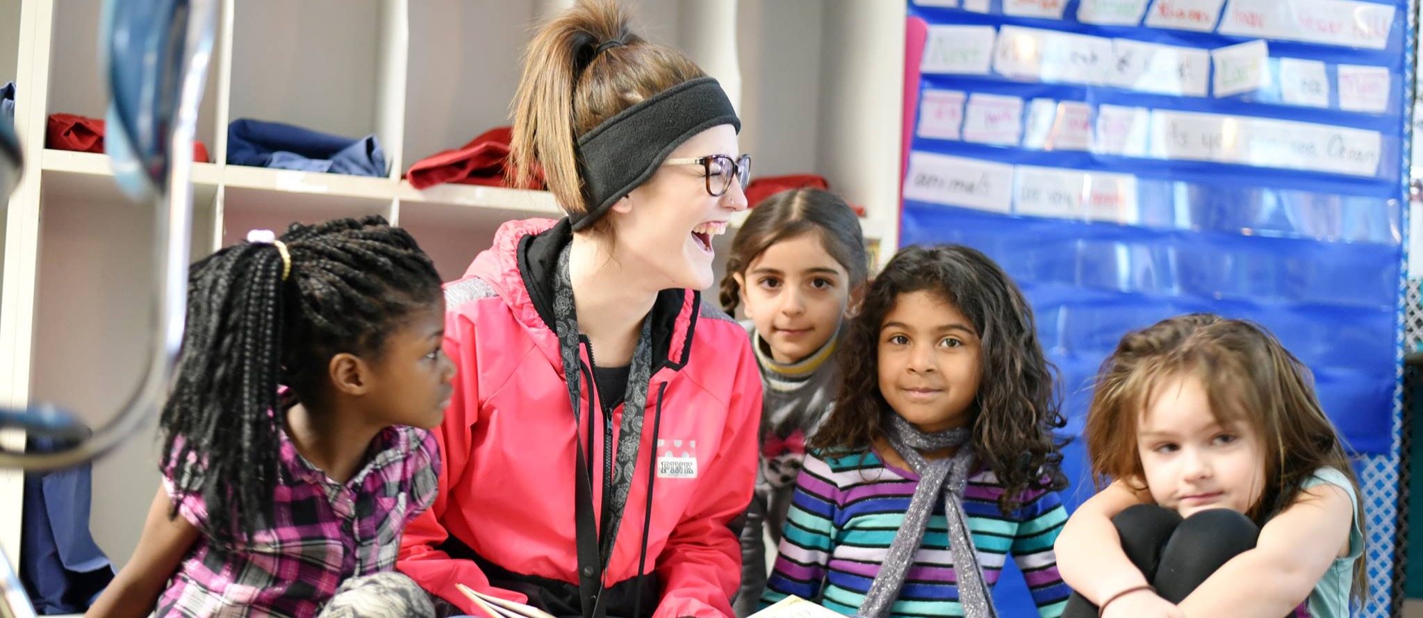 Kids reading with teacher