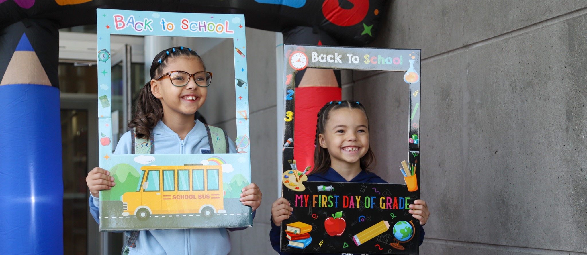 Kids smiling on the first day of school