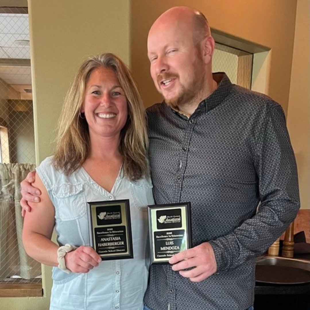 Two teachers from Cascade School District holding awards