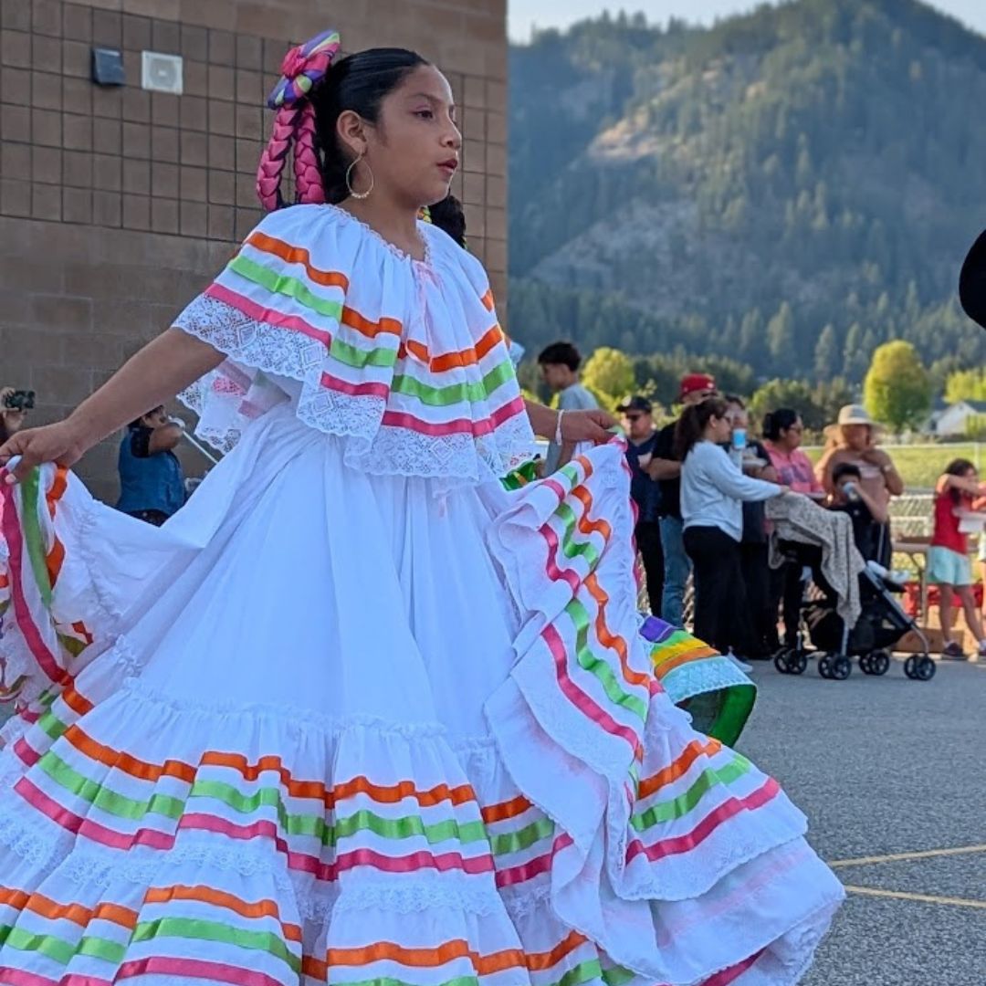 Girl in dress doing mexican folk dancing