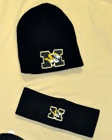 A beanie black hat with the school's logo.