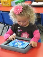 A girl playing with an I-Pad
