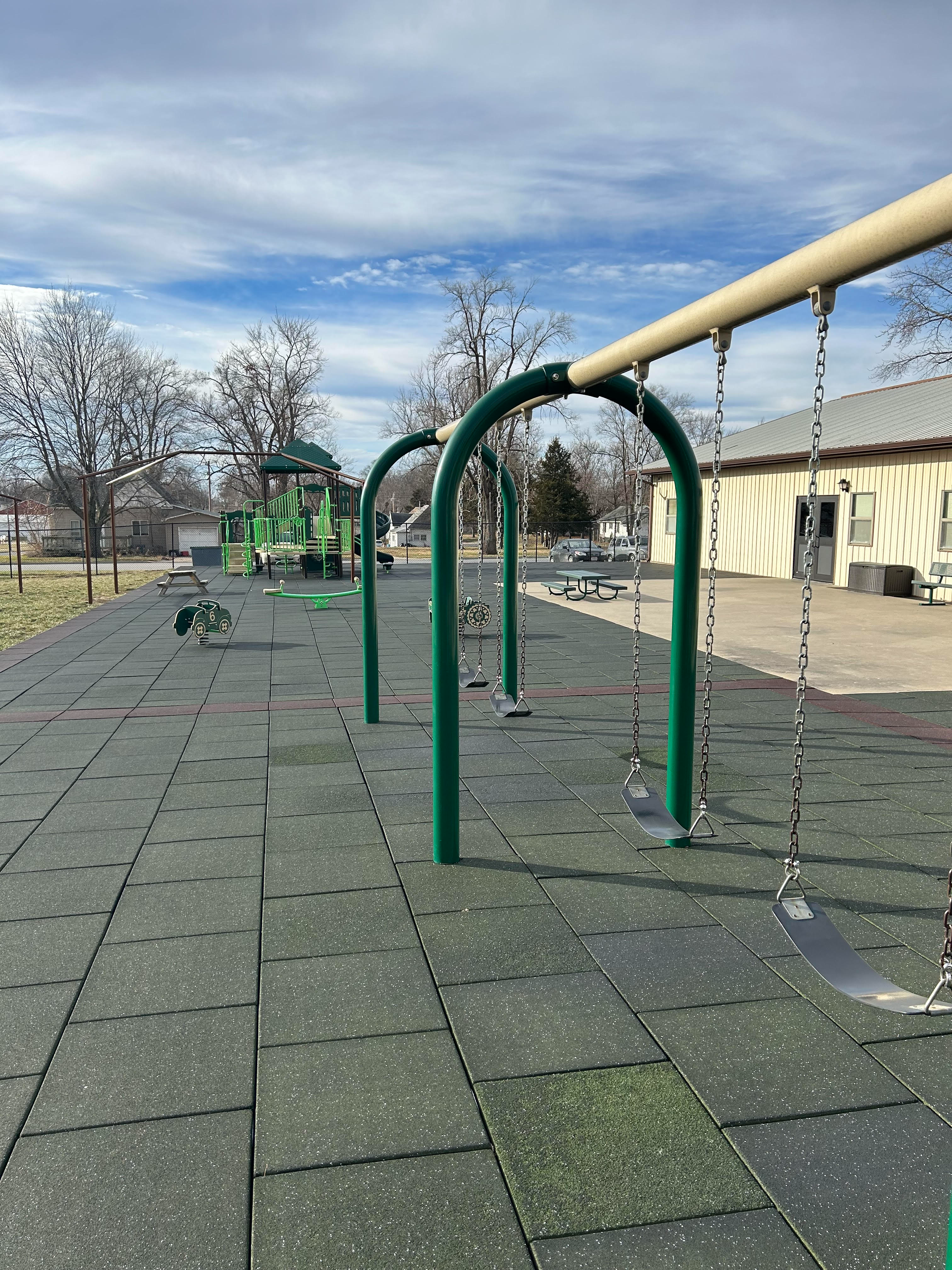 Two boys playing together in the school's playground.