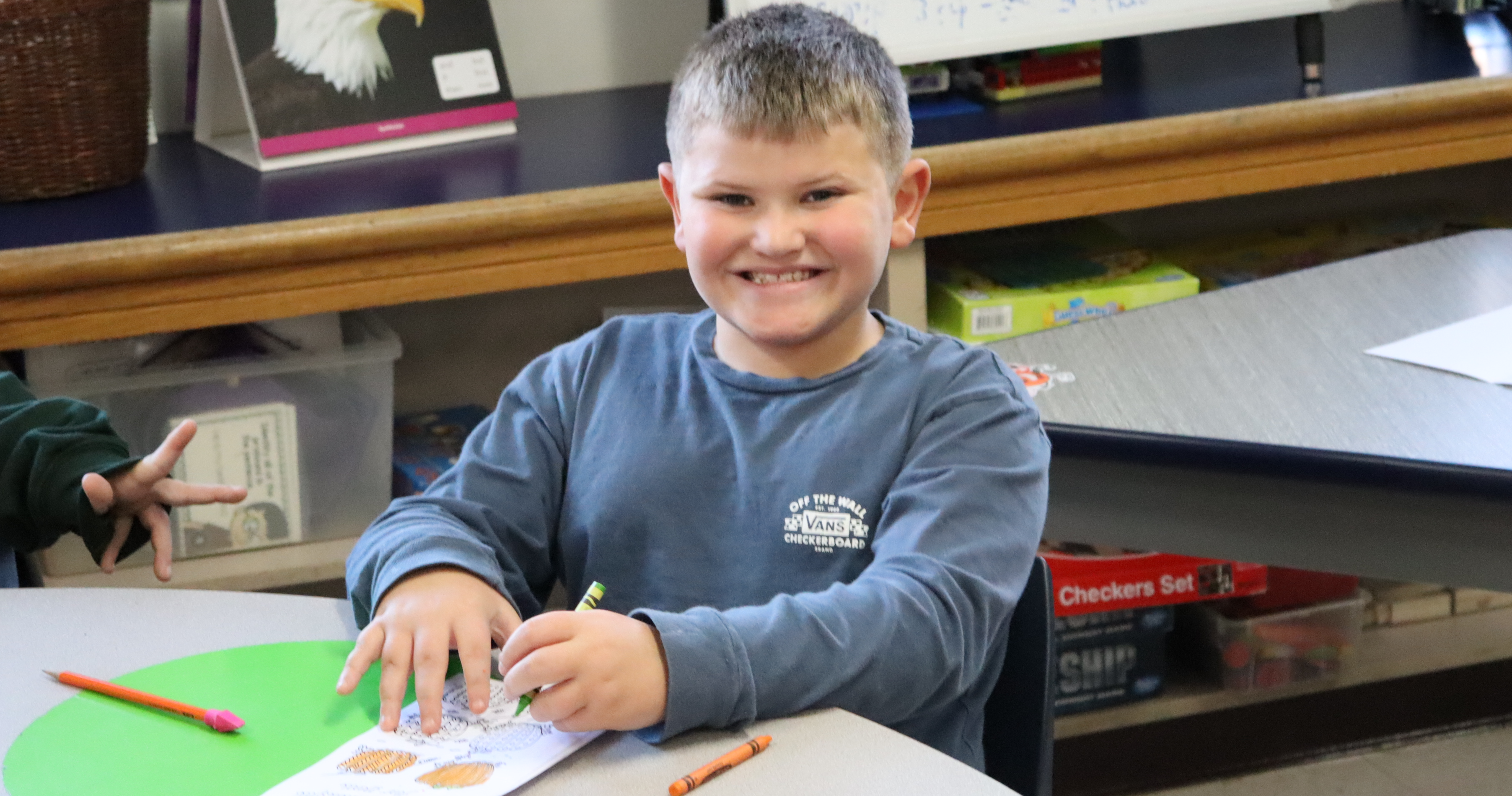 A student smiling at the camera