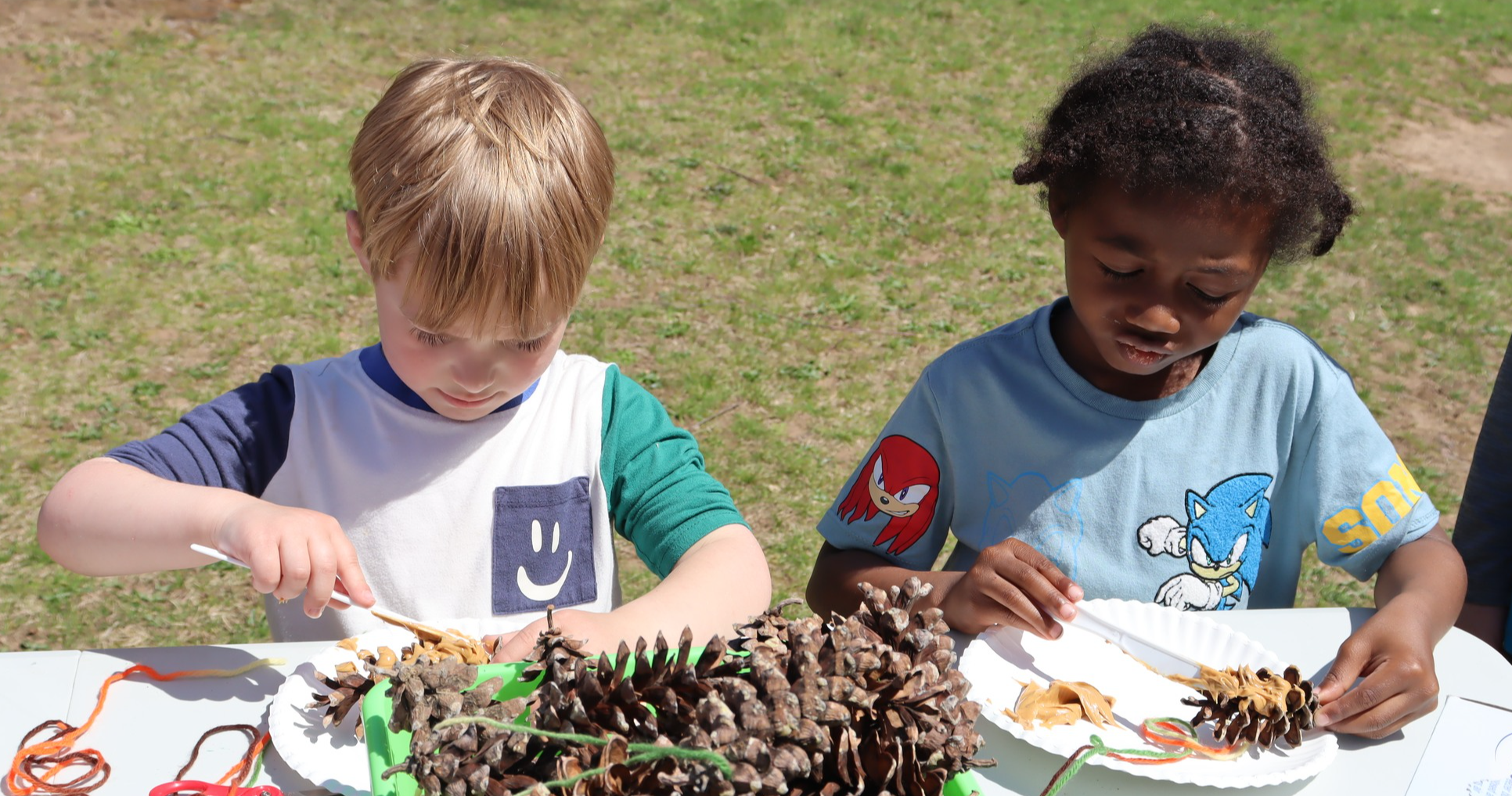 Pre-K students working on a project outside