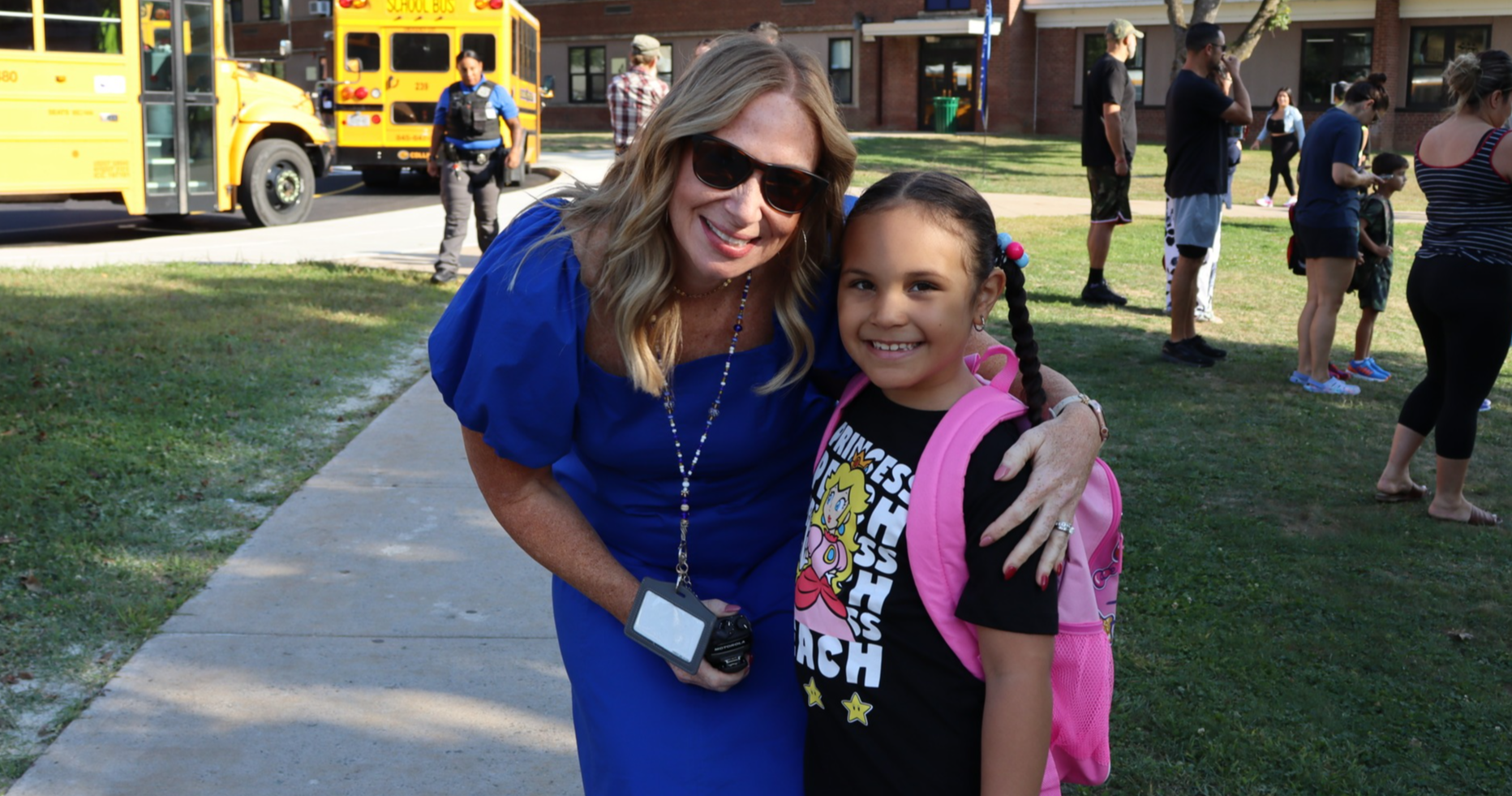 Principal Ey and a student outside