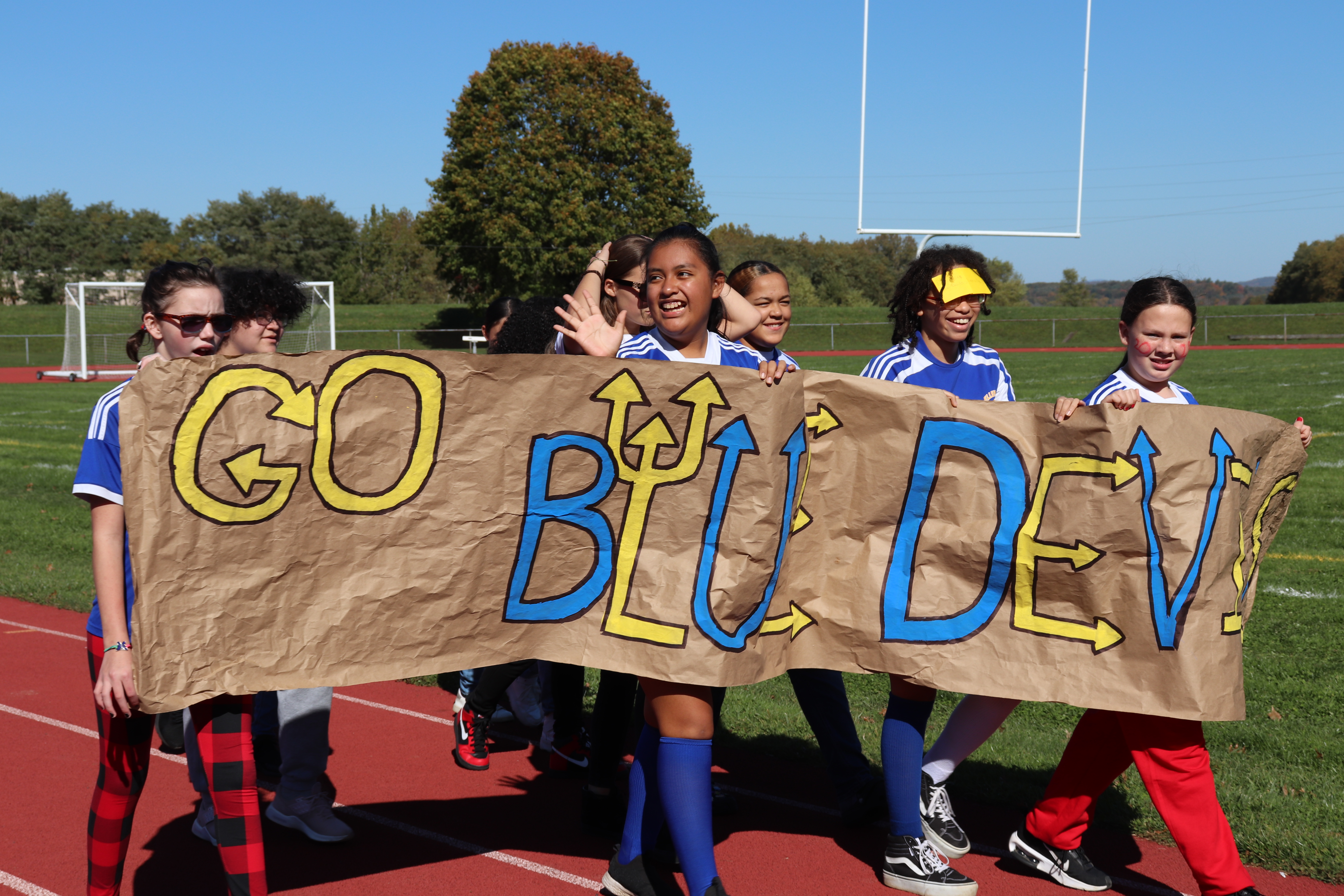 Students holding up Go Blue Devils signs