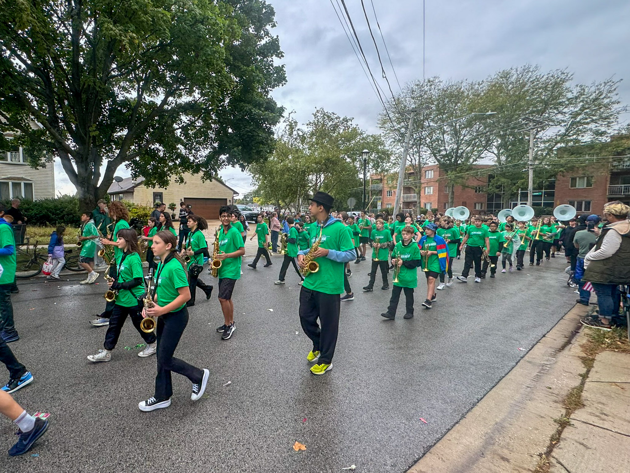 middle school Green Machine band marching downtown