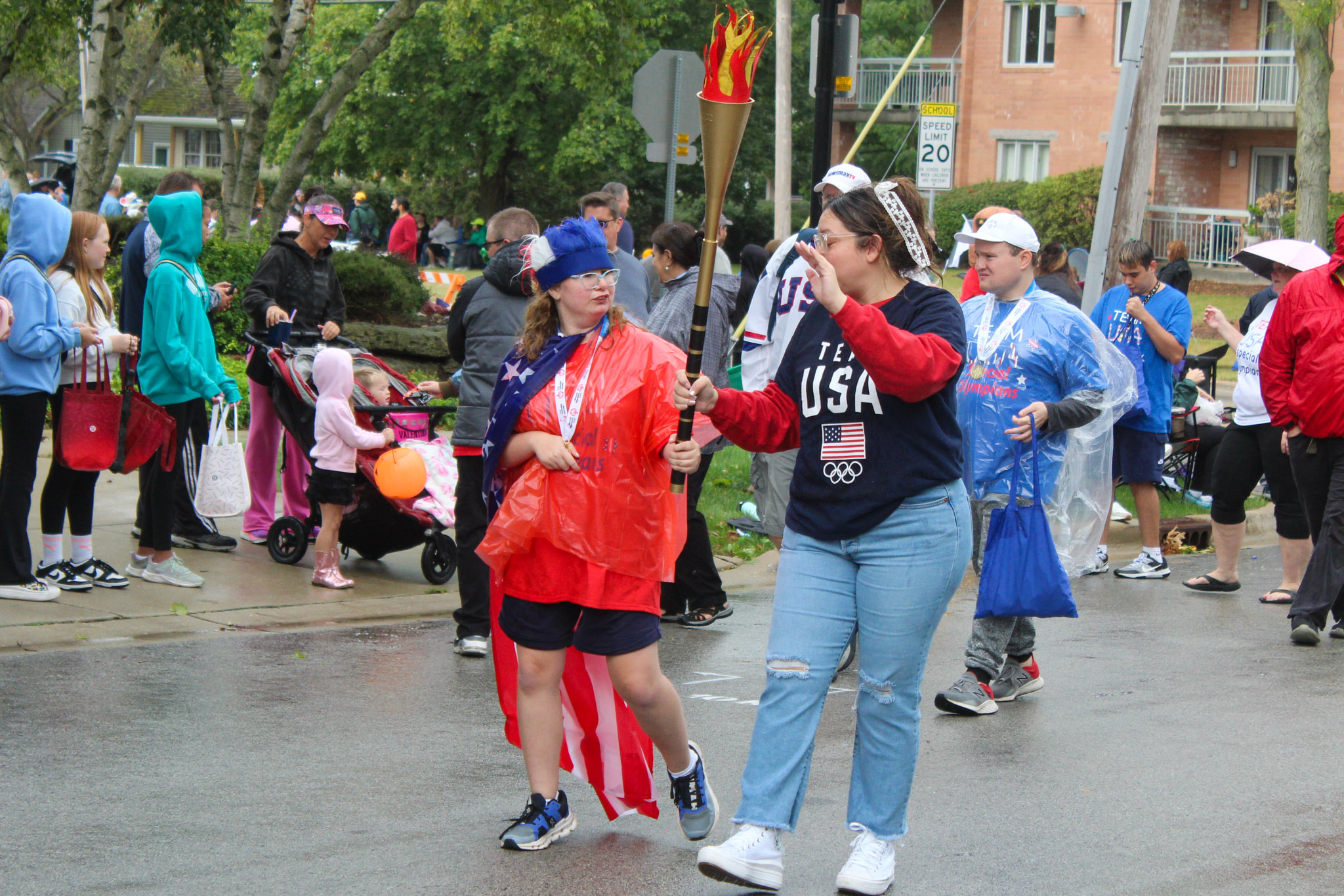 Special Olympic students walk in parade