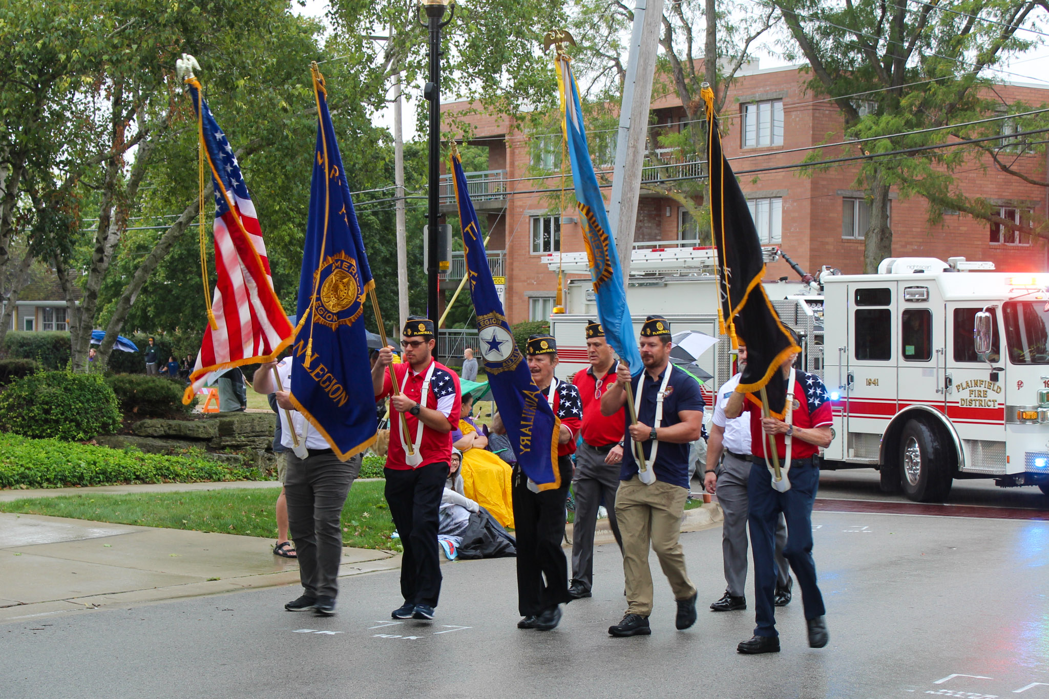 Veterans hold variety of flags to start parade