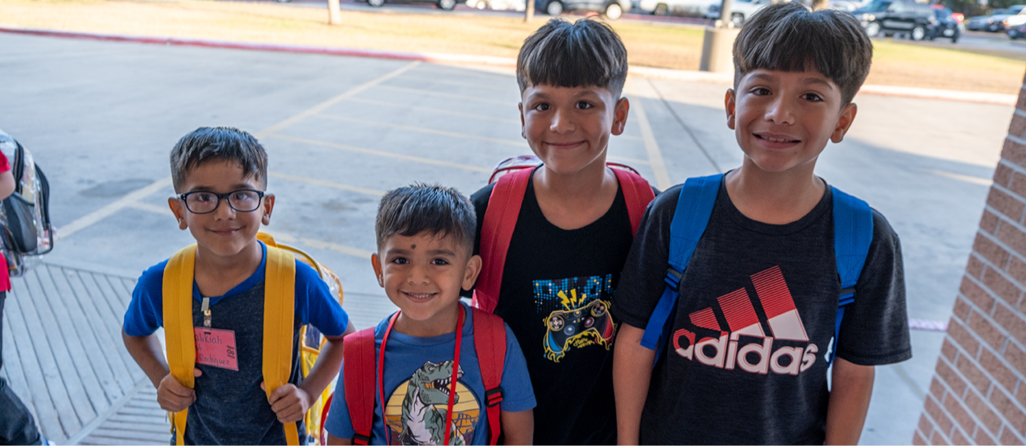 students in front of the school