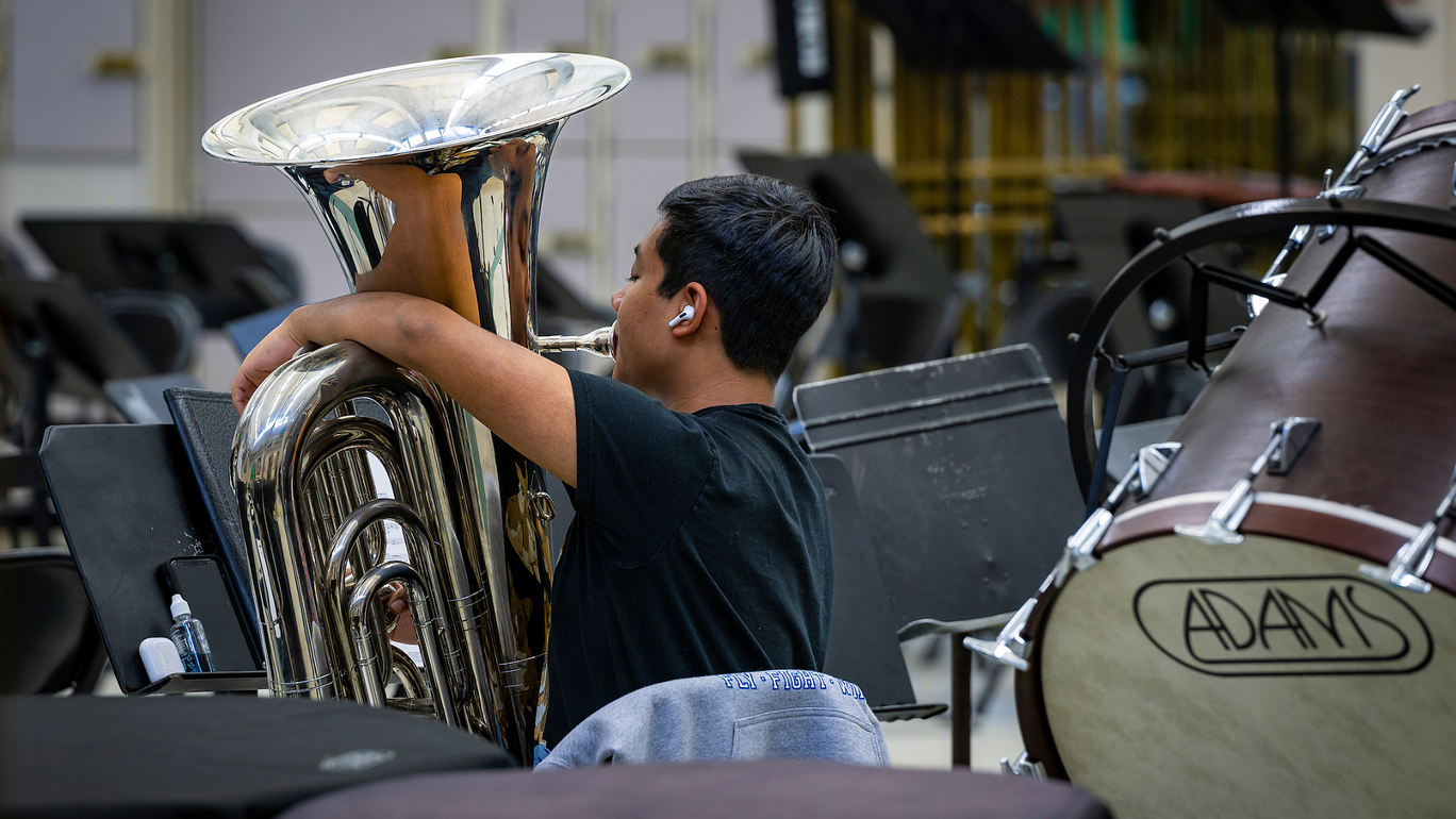 A student playing music