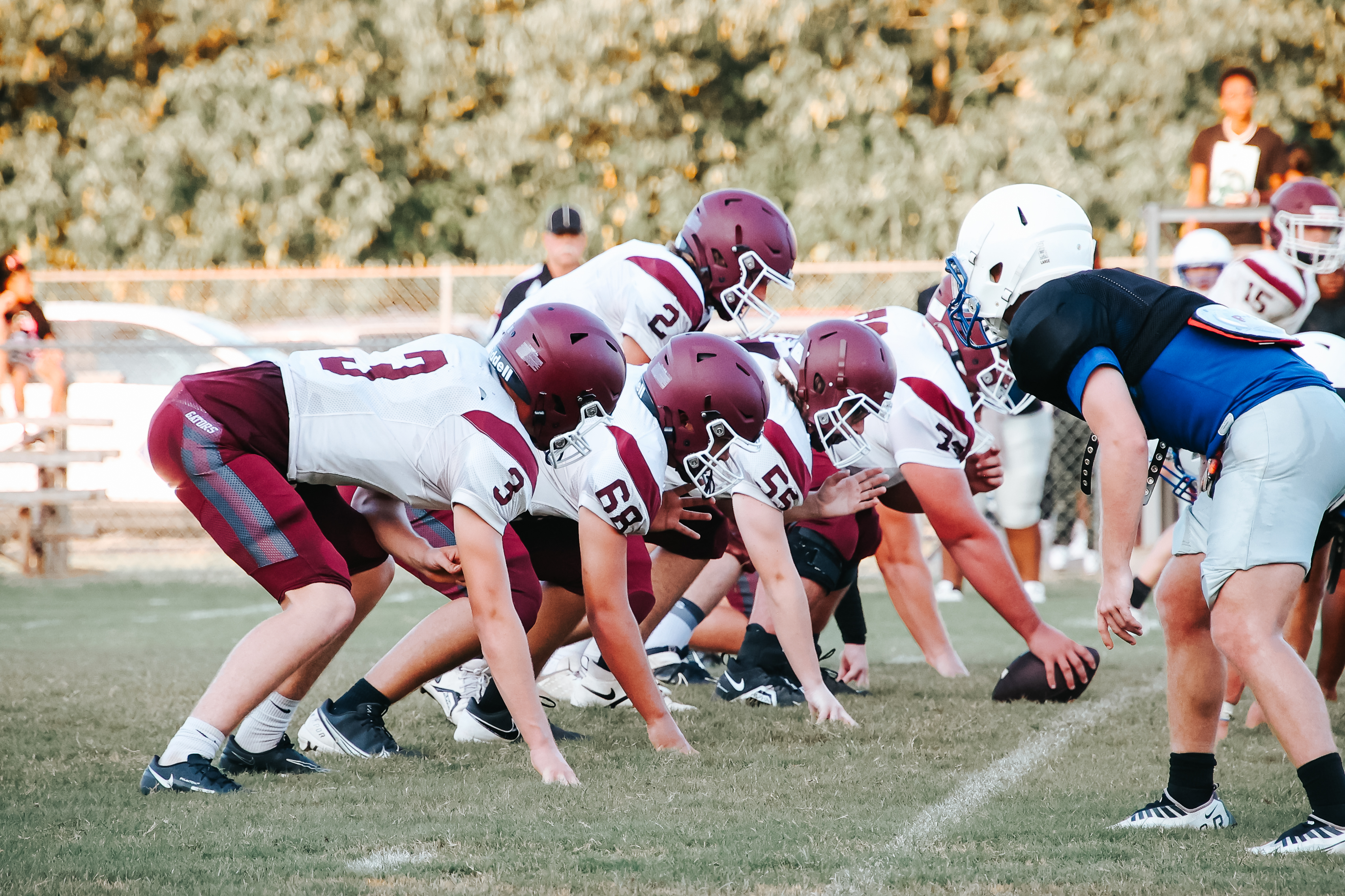 Football players on the line of scrimmage ready for a play