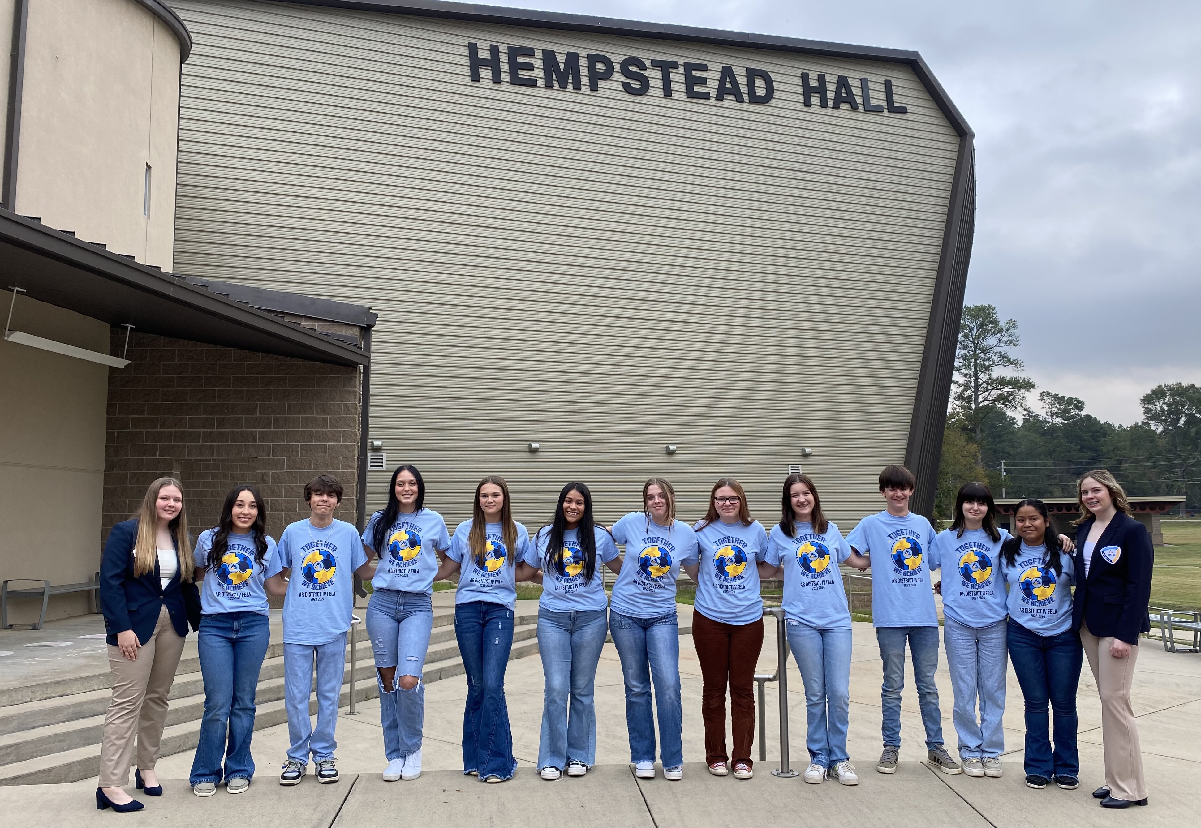 Students standing on sidewalk