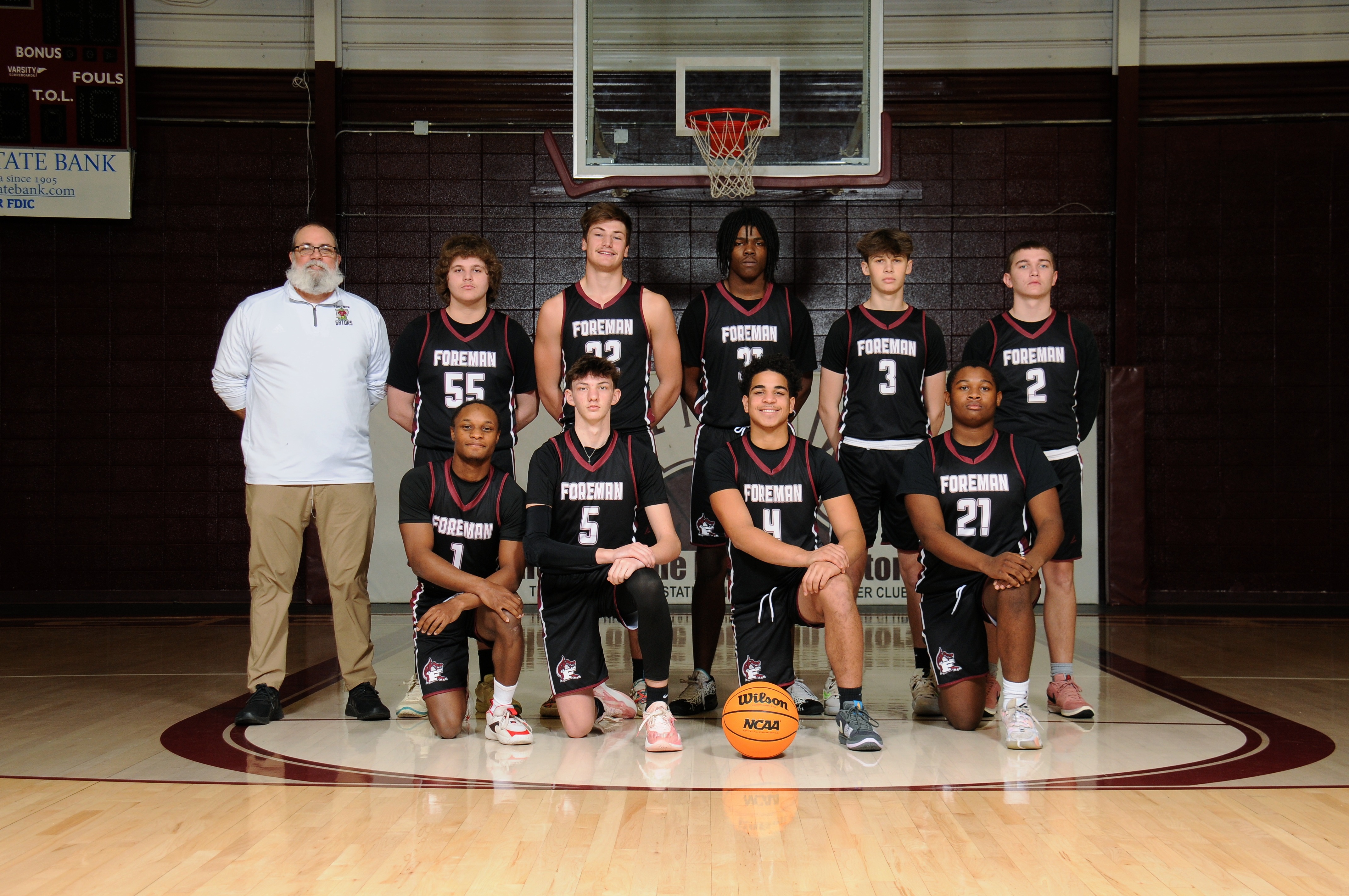 Boys posing for team pic in gym