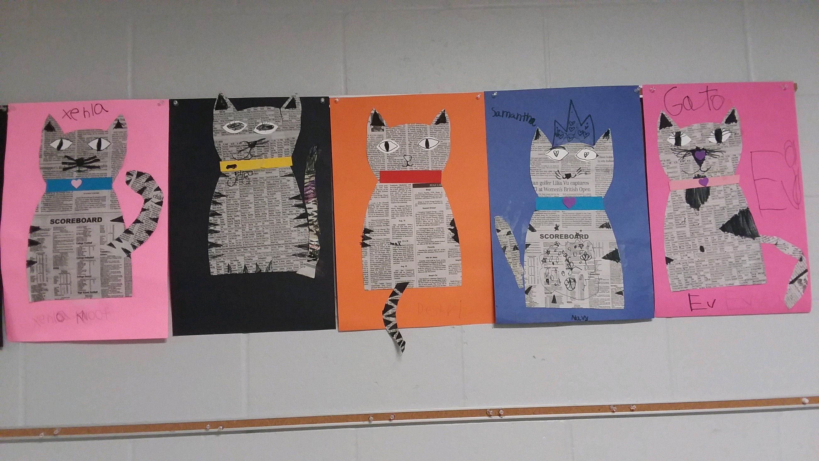 First grade students made cats out of newspaper.