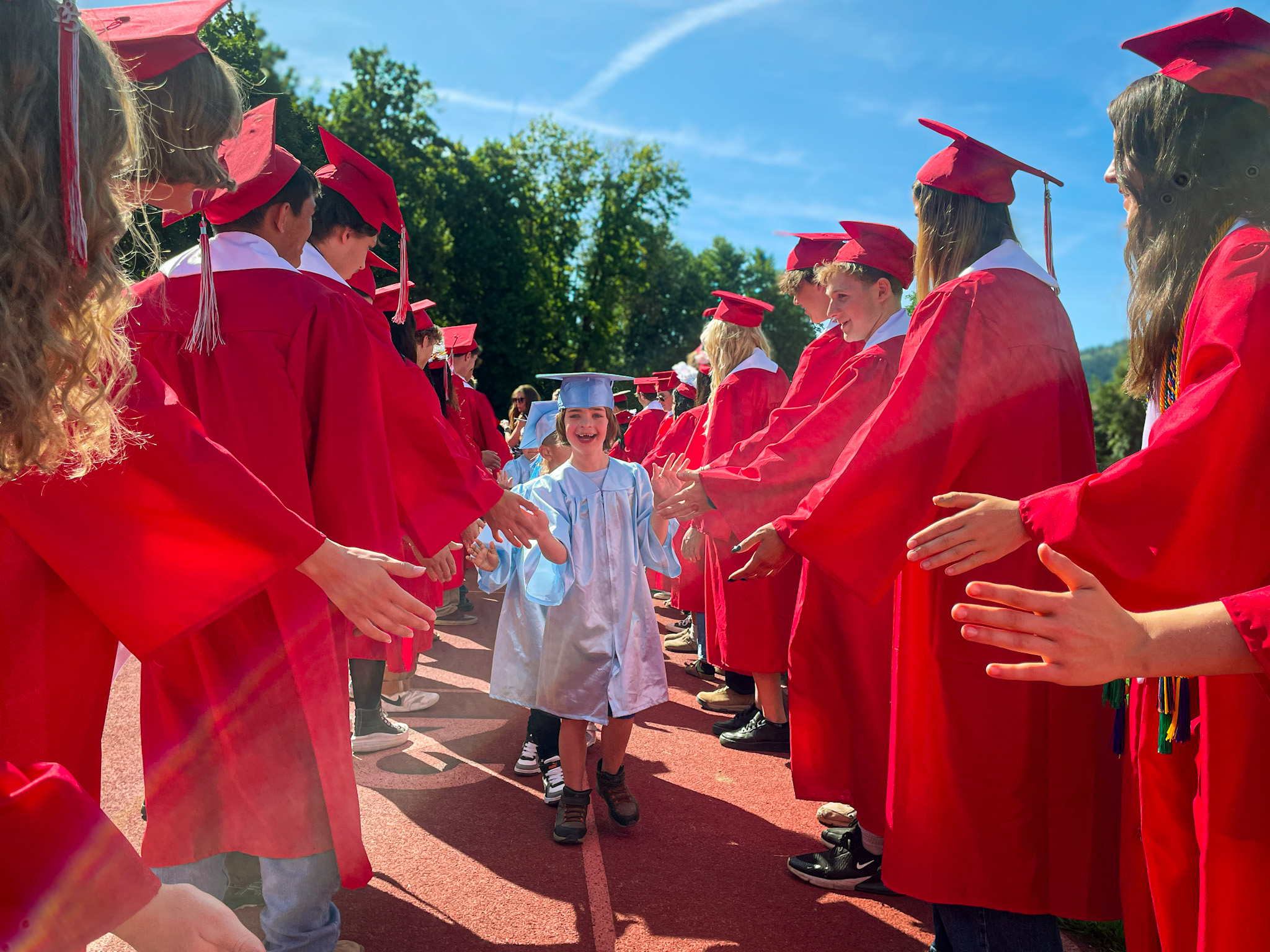 Student thrilled to graduate photo credit to Taylor Caldwell