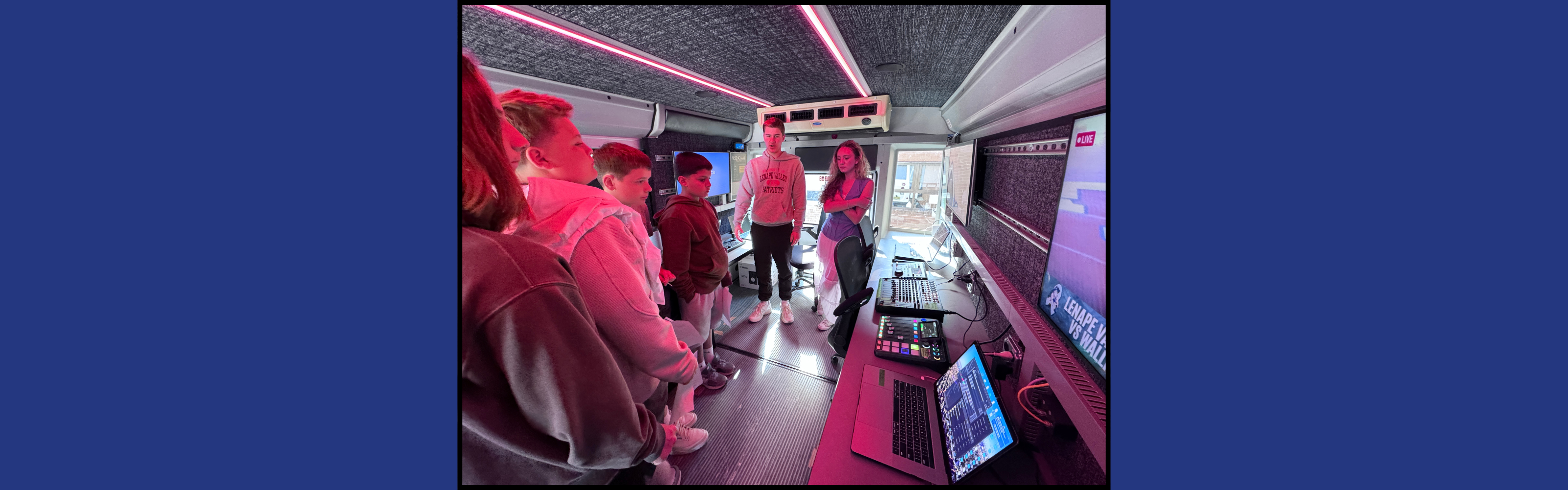 Michael Mariani and Isabella Pita giving students a tour of our new live-streaming production bus during  Byram’s Career Day.