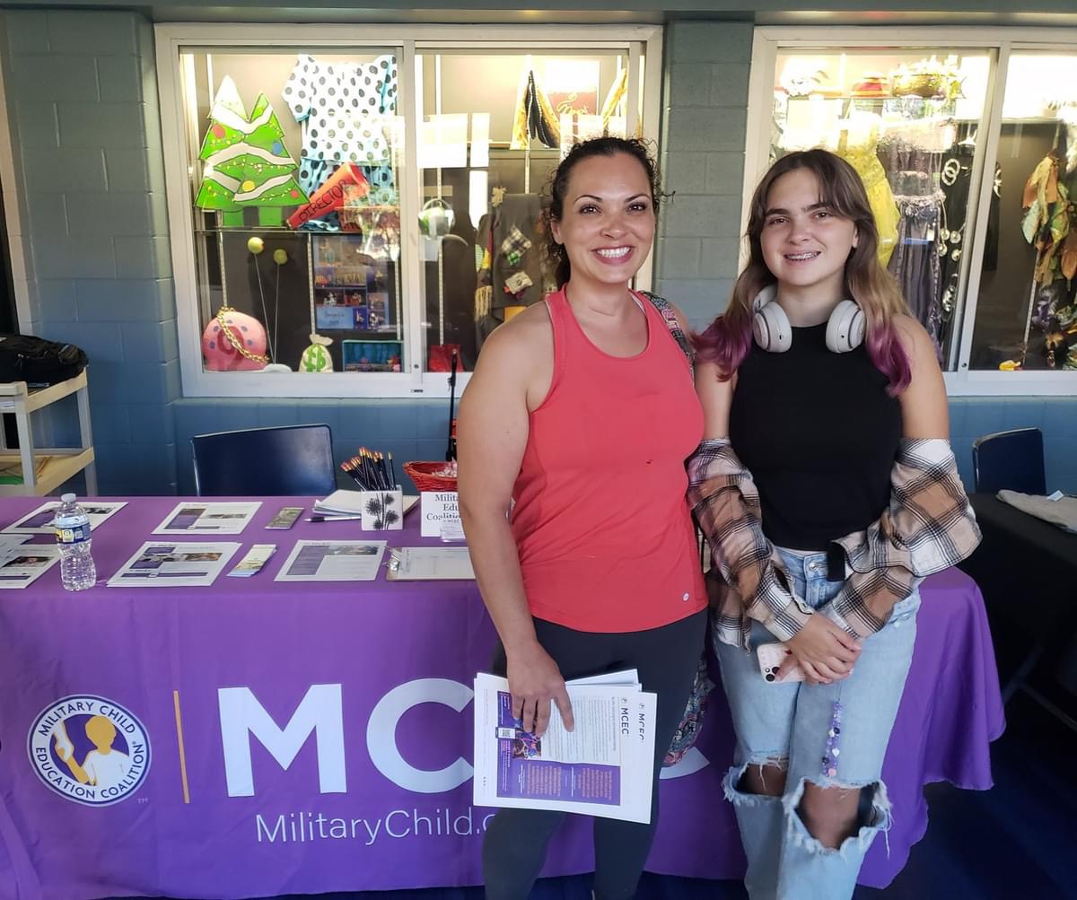 A mother and daughter pose at New Century.