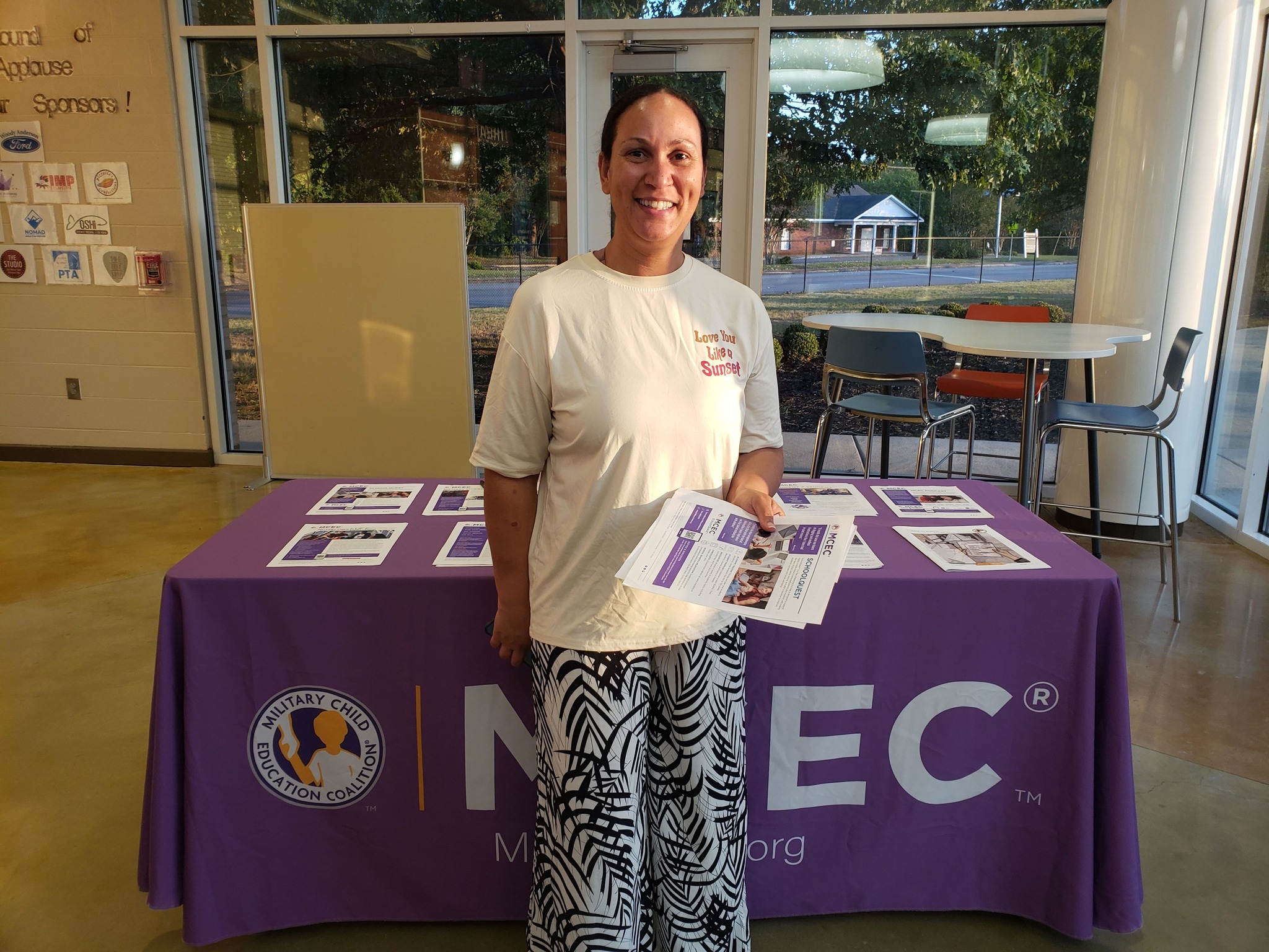 Woman standing in front of a table