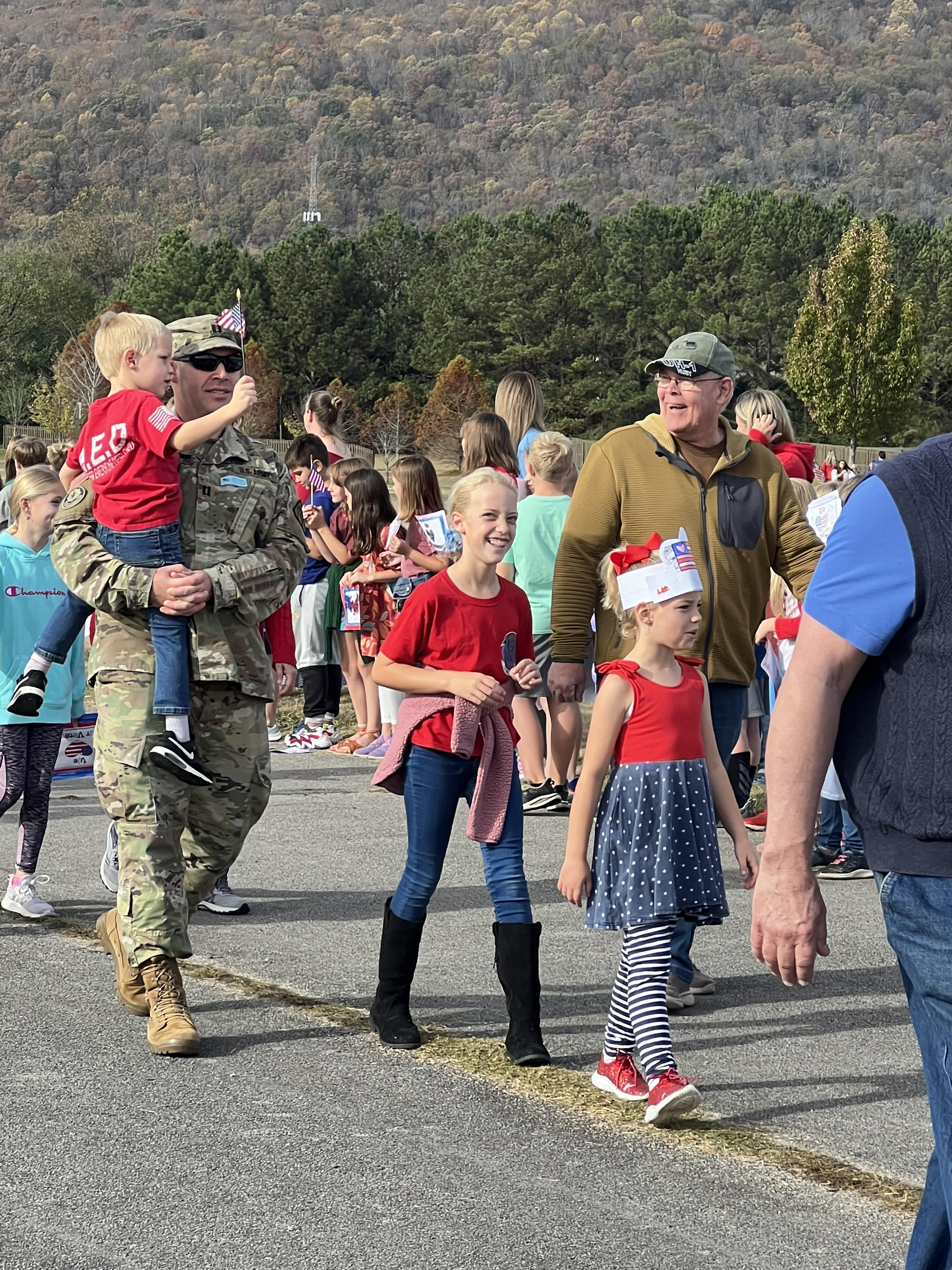 Students and family walking in parade