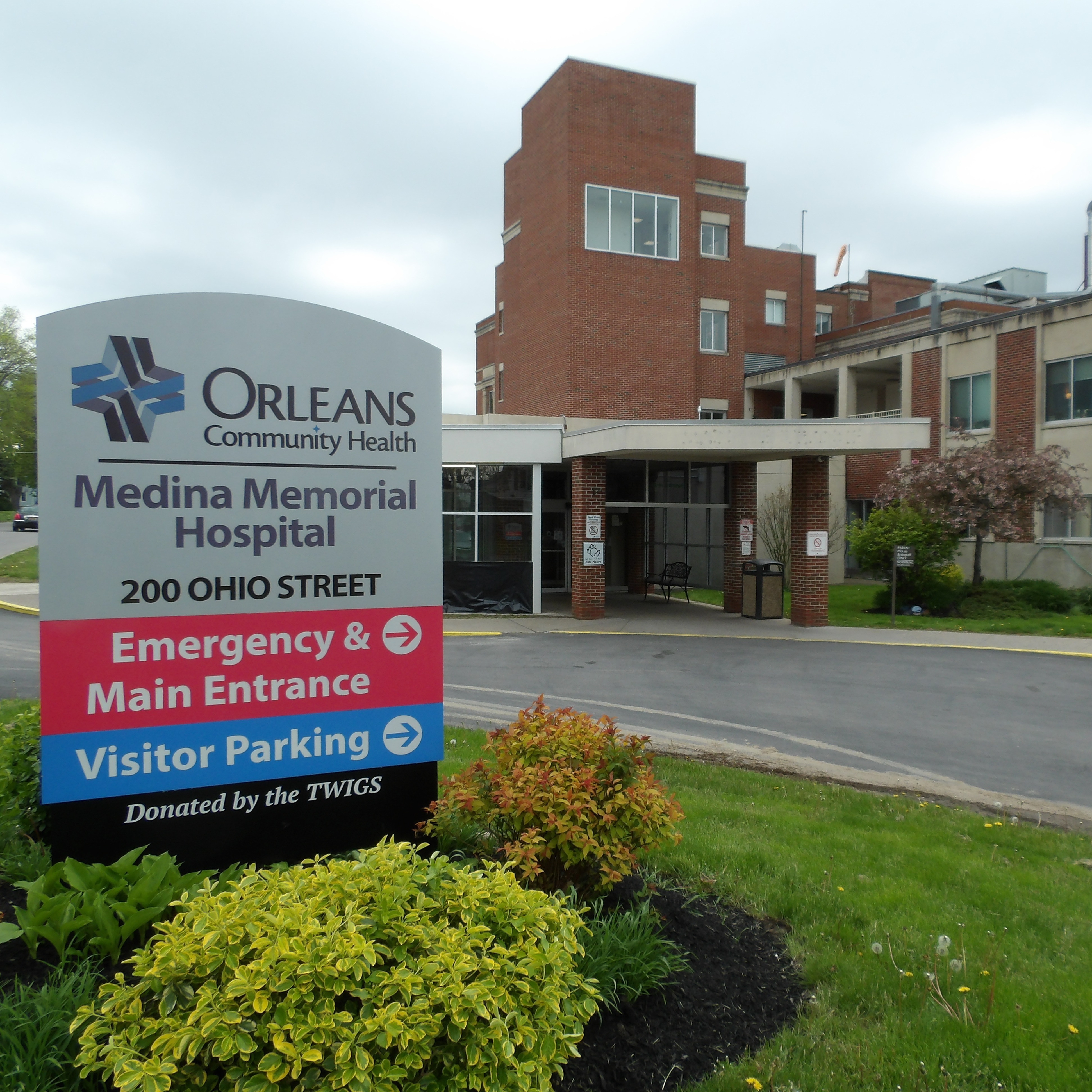 front of Orleans Community Health, including road sign
