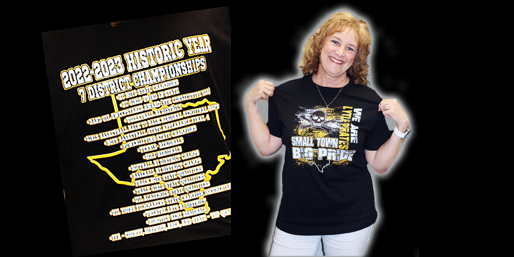 High School Principal Elizabeth Stewart shows off her Champions t-shirt listing athletic, academic, band, and FFA students accomplishments in a history-making 2022-2023 school year. 