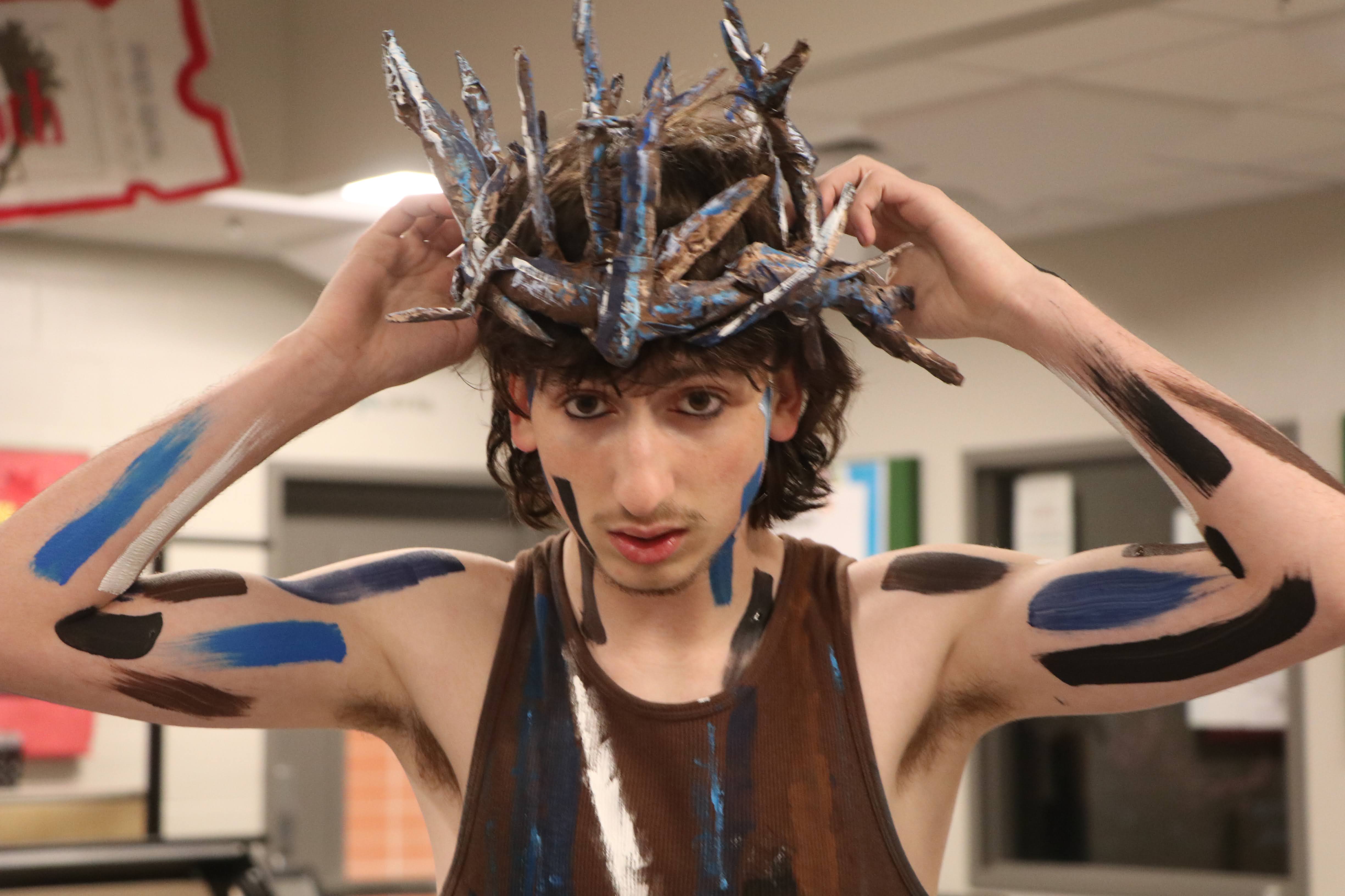 Stefan Emery makes sure his costume is complete