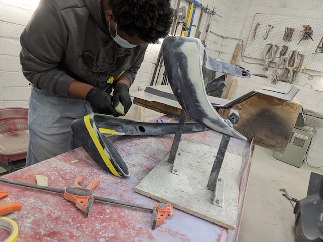 student working on a bumper
