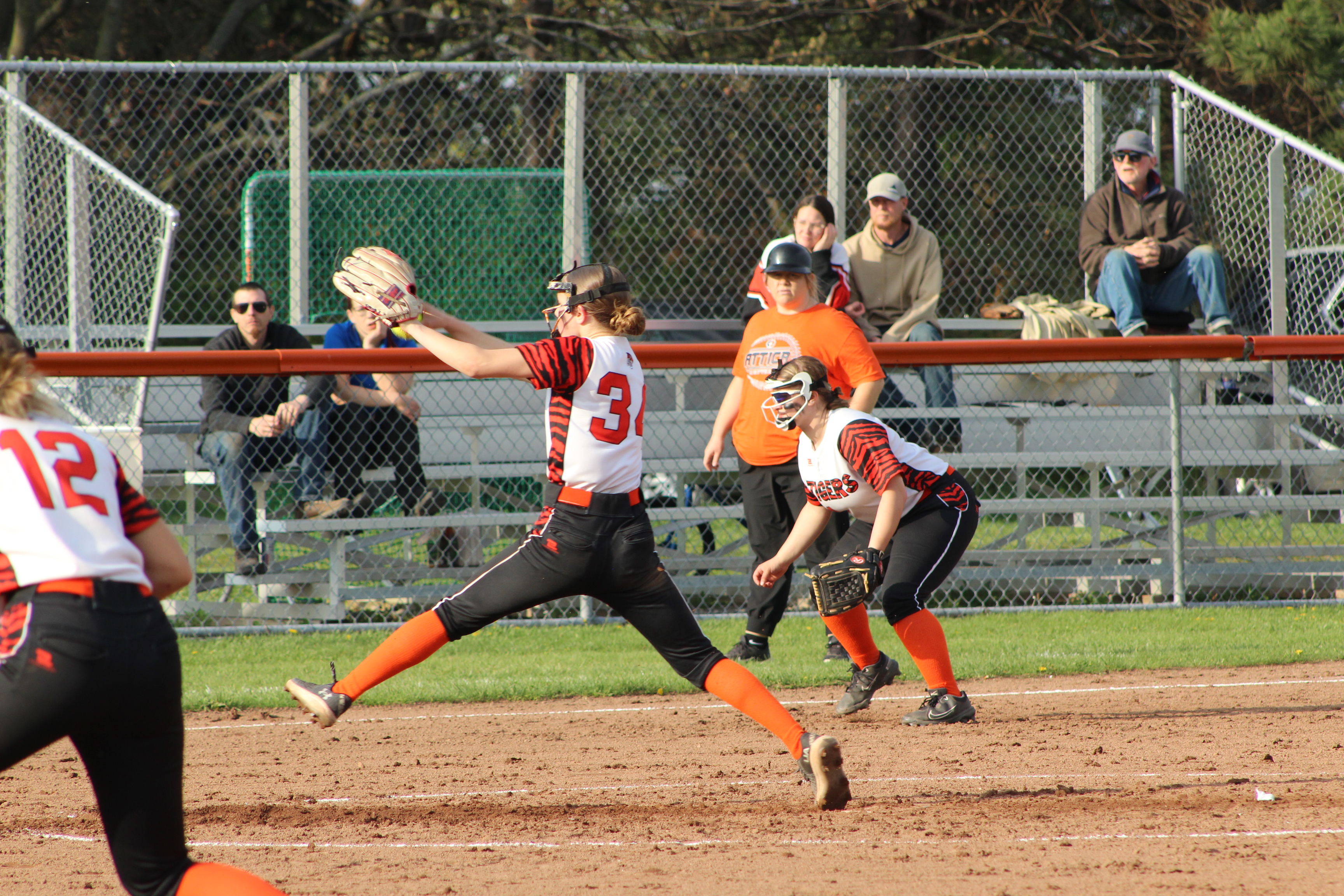girl pitching softball