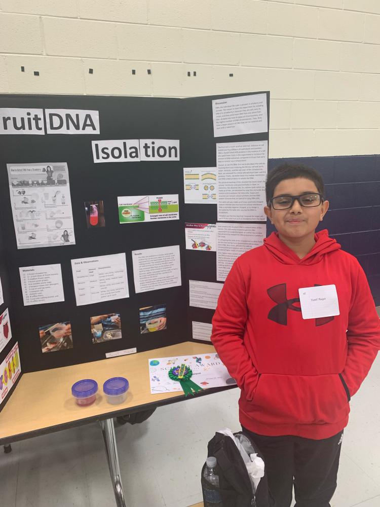 student showing their science project