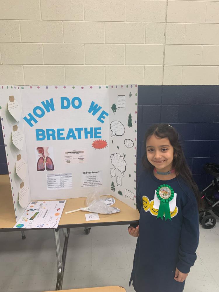 student showing their science project