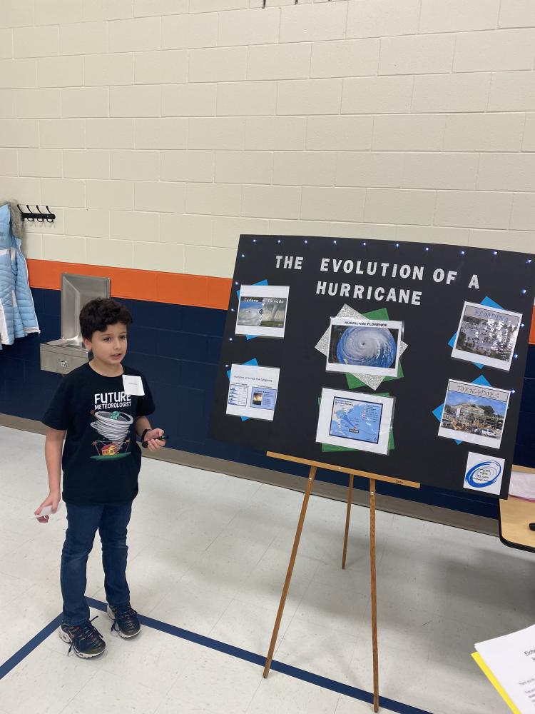 student showing their science project