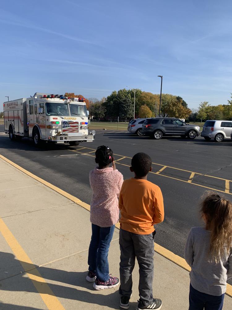 students at a demonstration on fire truck