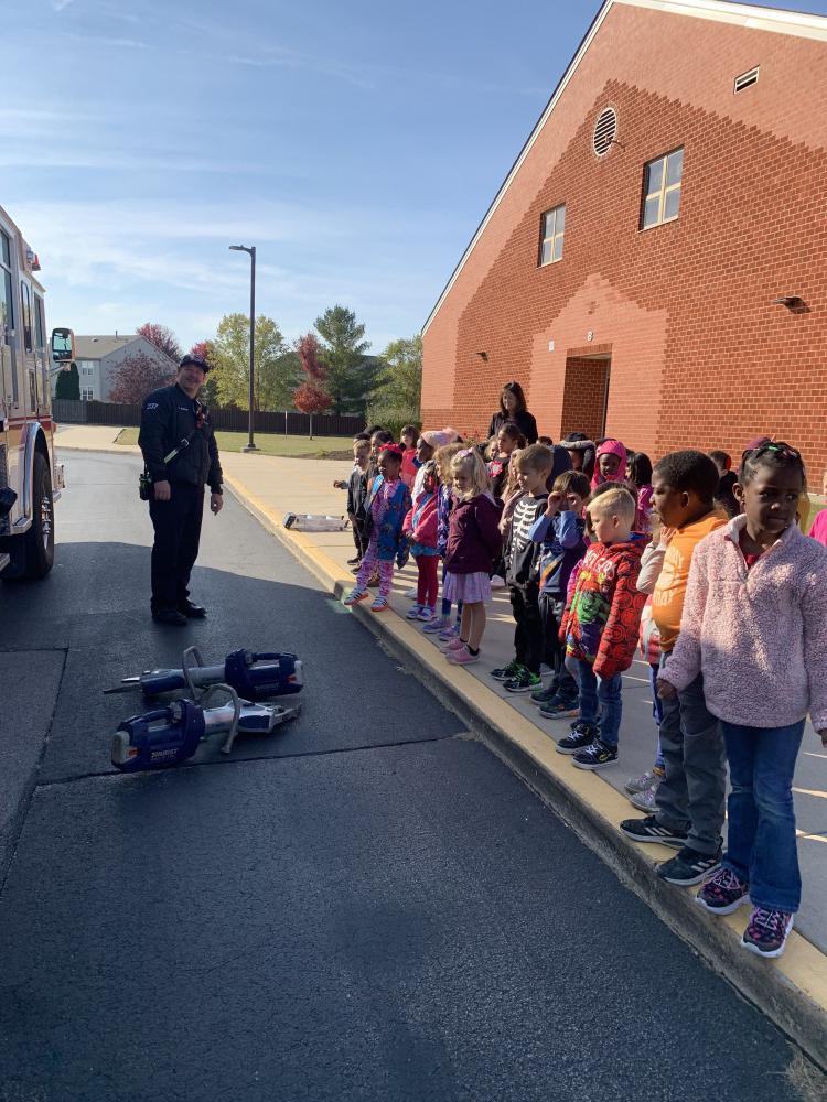 students at a demonstration on fire truck