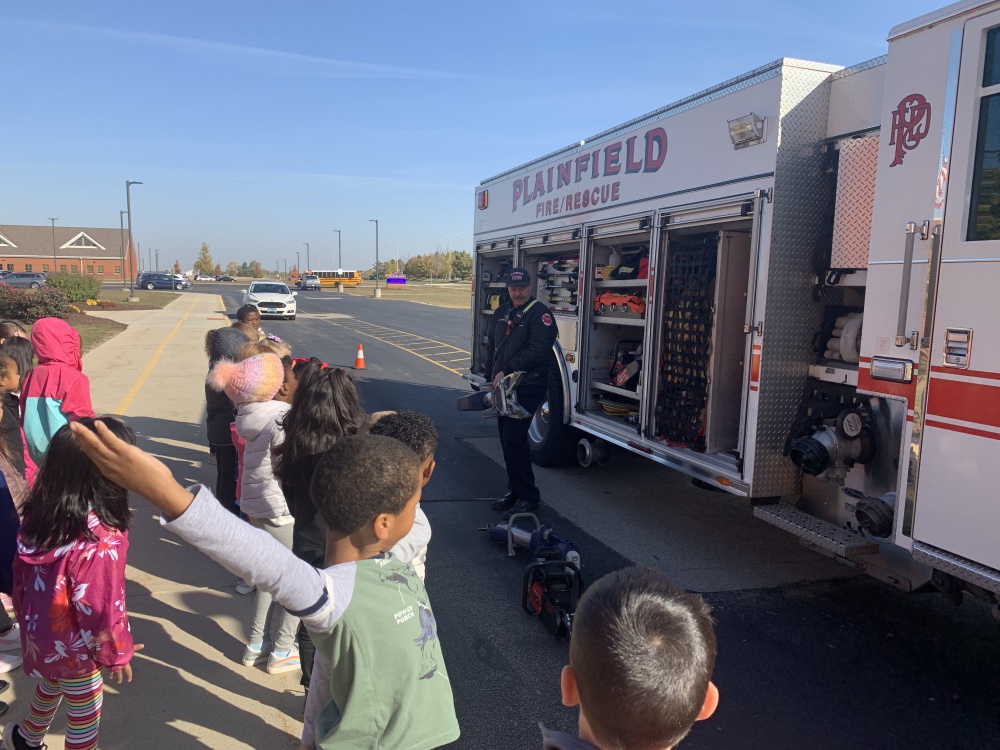 students at a demonstration on fire truck