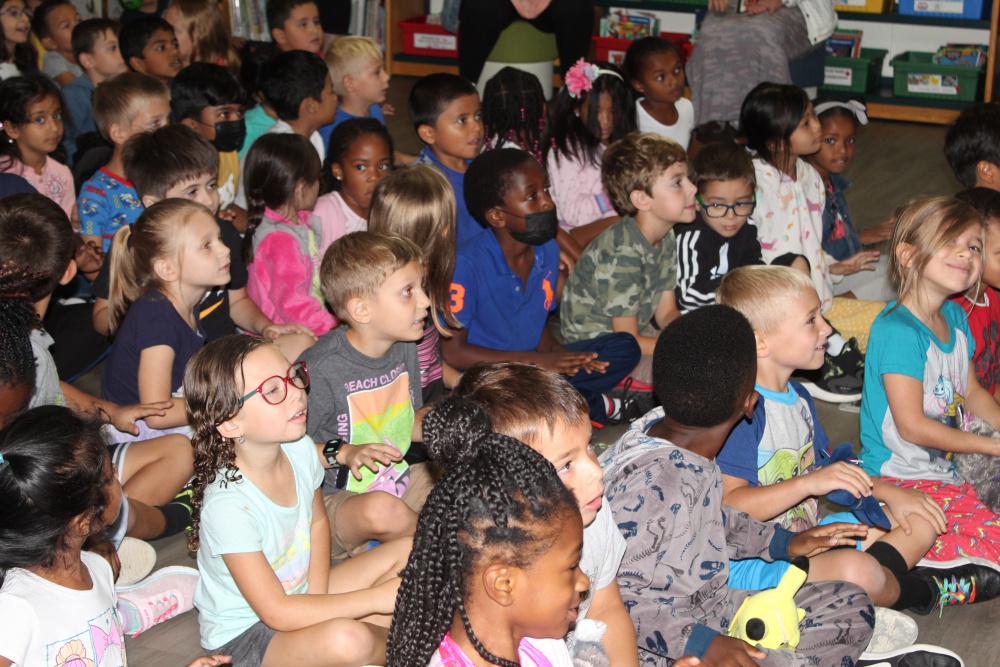 students together in a room watching demonstration