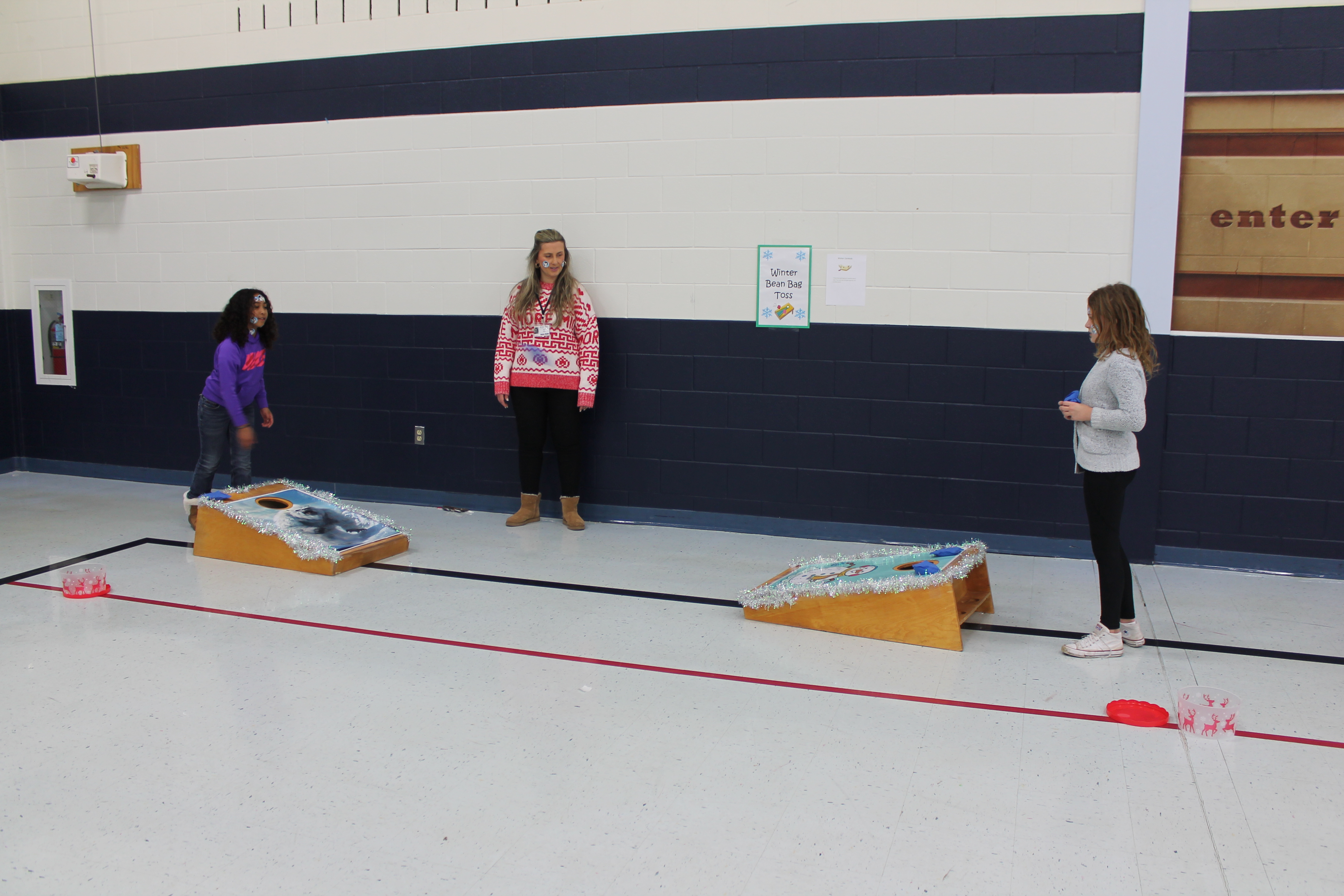 Students enjoy holiday games and crafts at winter-themed parties.